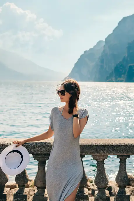 A woman standing infront of Lake Garda