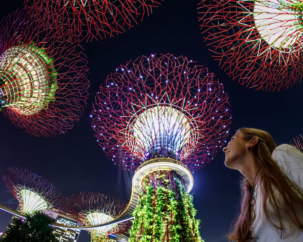 A woman looking up at the Garden By The Bay in Singapore