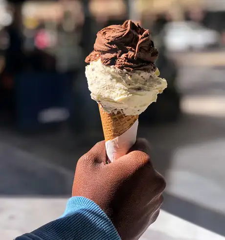 A Person holding an Ice Cream Cone