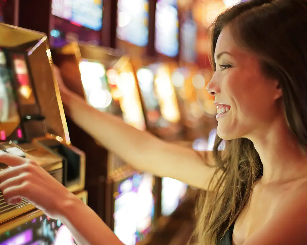 A woman in Las Vegas playing a slot machine