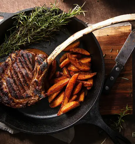 A Lamb steak with carrots