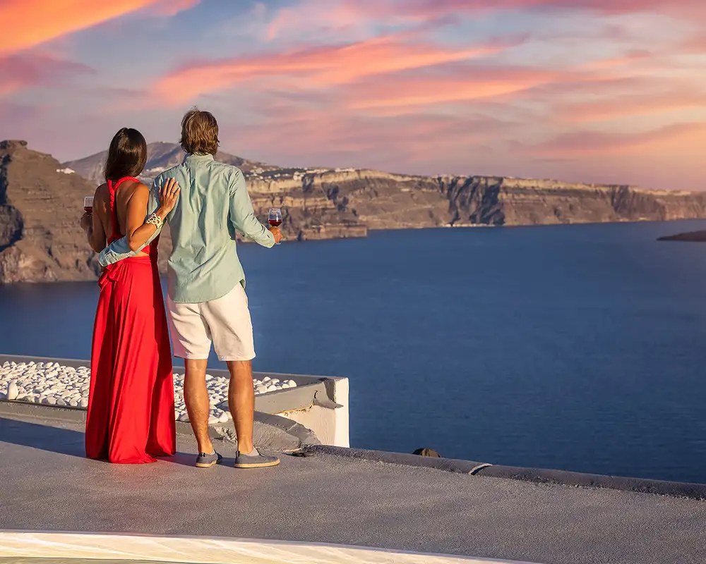 A Couple looking out over the ocean in Santorini