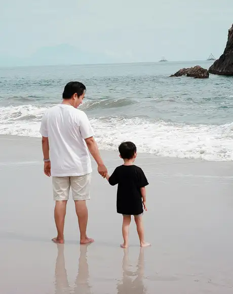A Parent and Child at the beach