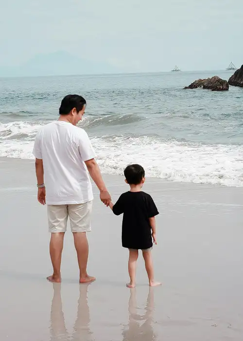 A Parent and Child at the beach