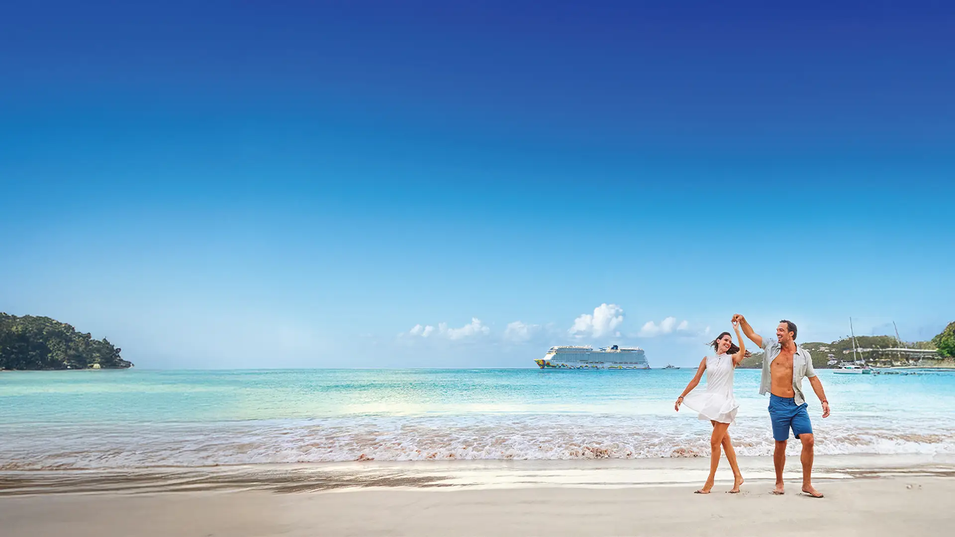 A couple dances joyfully on a sunny beach with clear blue water and a cruise ship in the background.