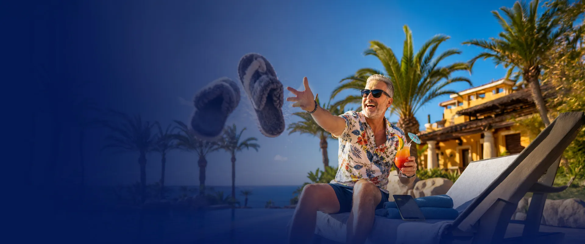 A man in sunglasses and a floral shirt throws slippers while sitting on a lounge chair, holding a tropical drink, with palm trees in the background.
