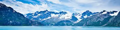 An Alaskan landscape with snowy mountains