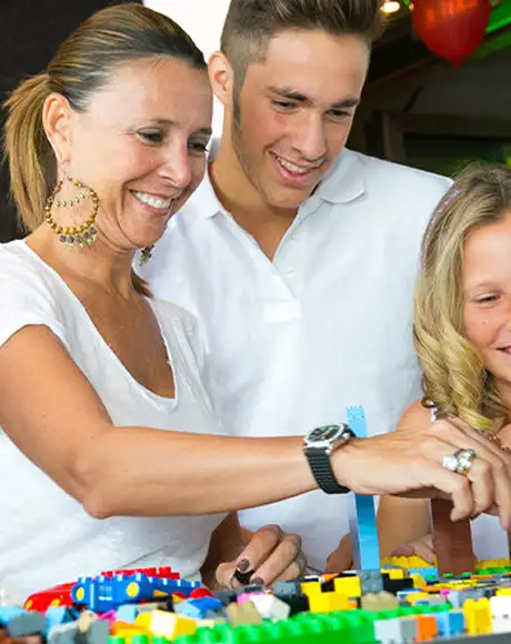 A Family playing with Lego