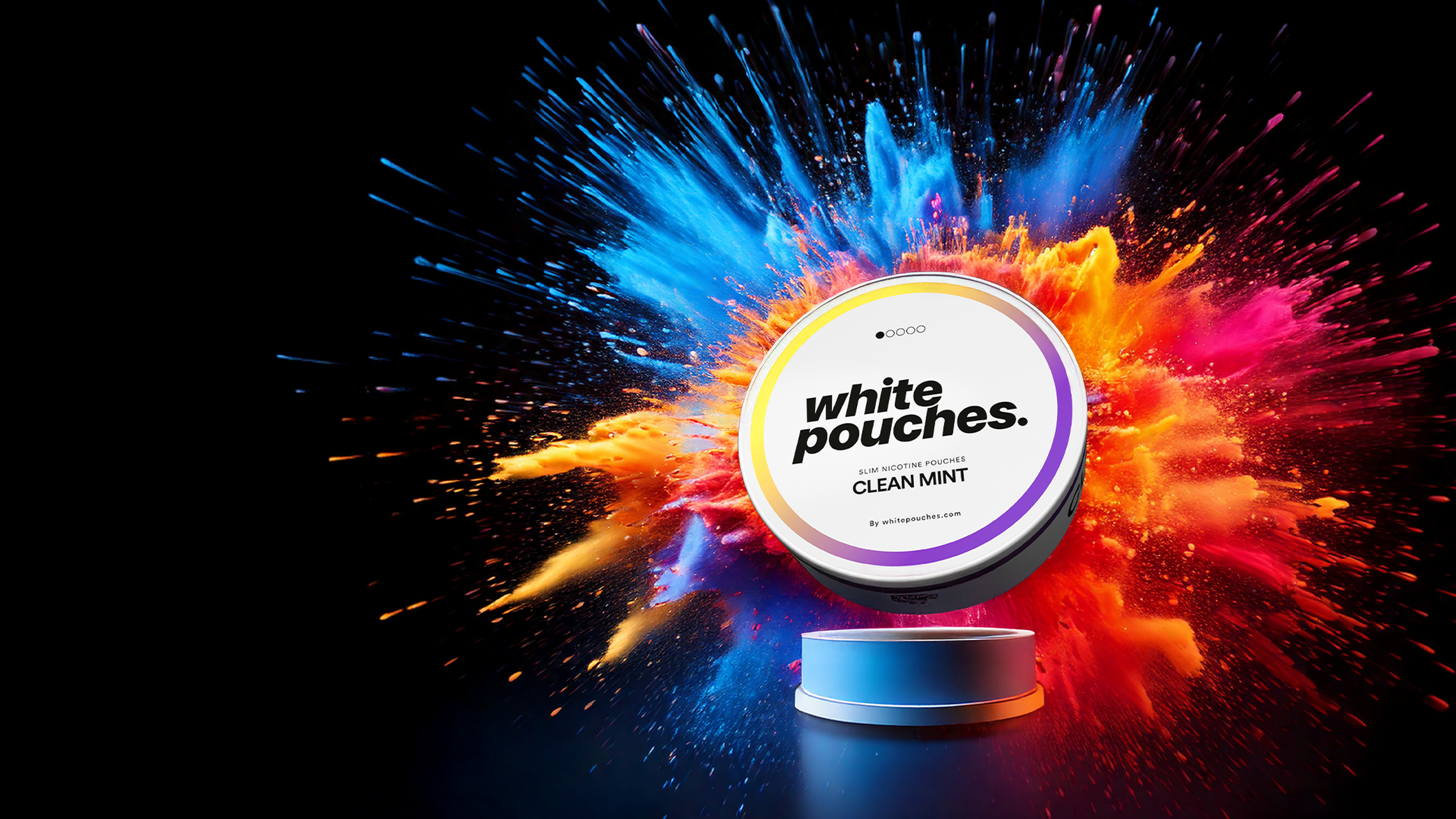 A round tin labeled 'white pouches. CLEAN MINT' is placed on a reflective surface, with a burst of vibrant blue, orange, and red powder exploding behind it against a black background. The tin is centrally positioned, with dynamic color contrast creating a striking visual effect.