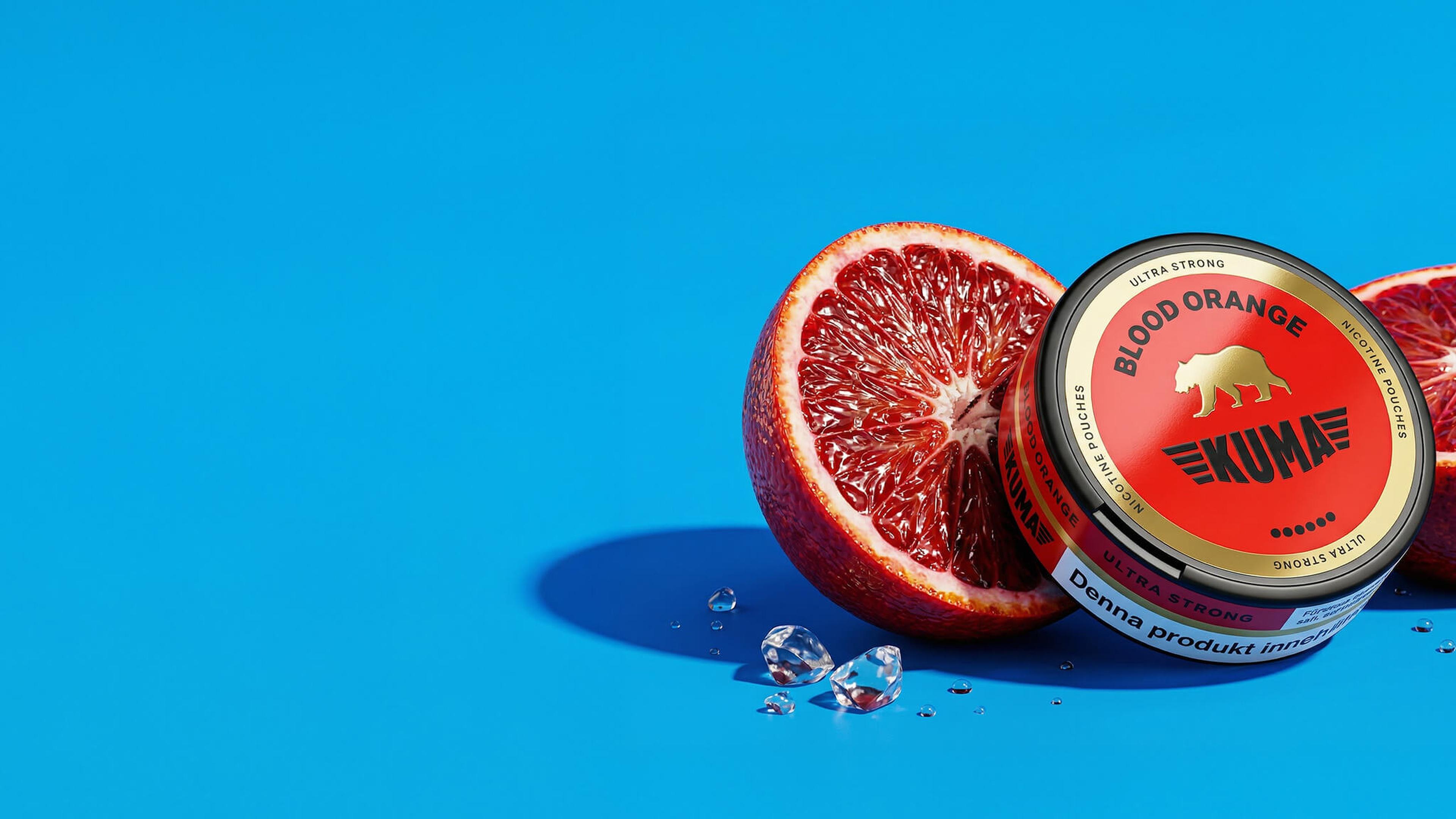 Tin of "Blood Orange" KUMA snus next to halved blood orange and ice cubes on a bright blue background.