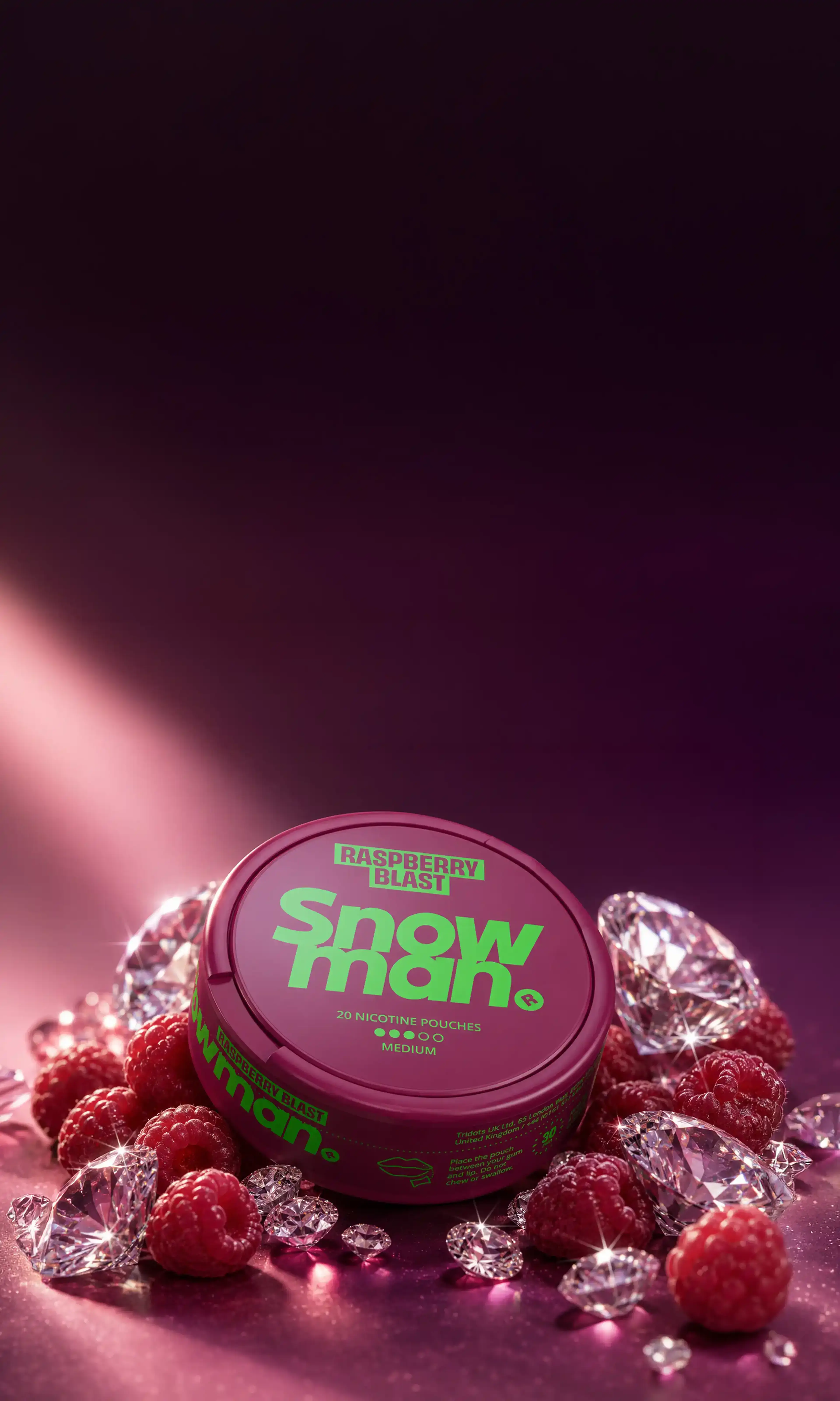 A container of Snowman Raspberry Blast nicotine pouches surrounded by raspberries and sparkling gemstones on a pinkish-purple background.