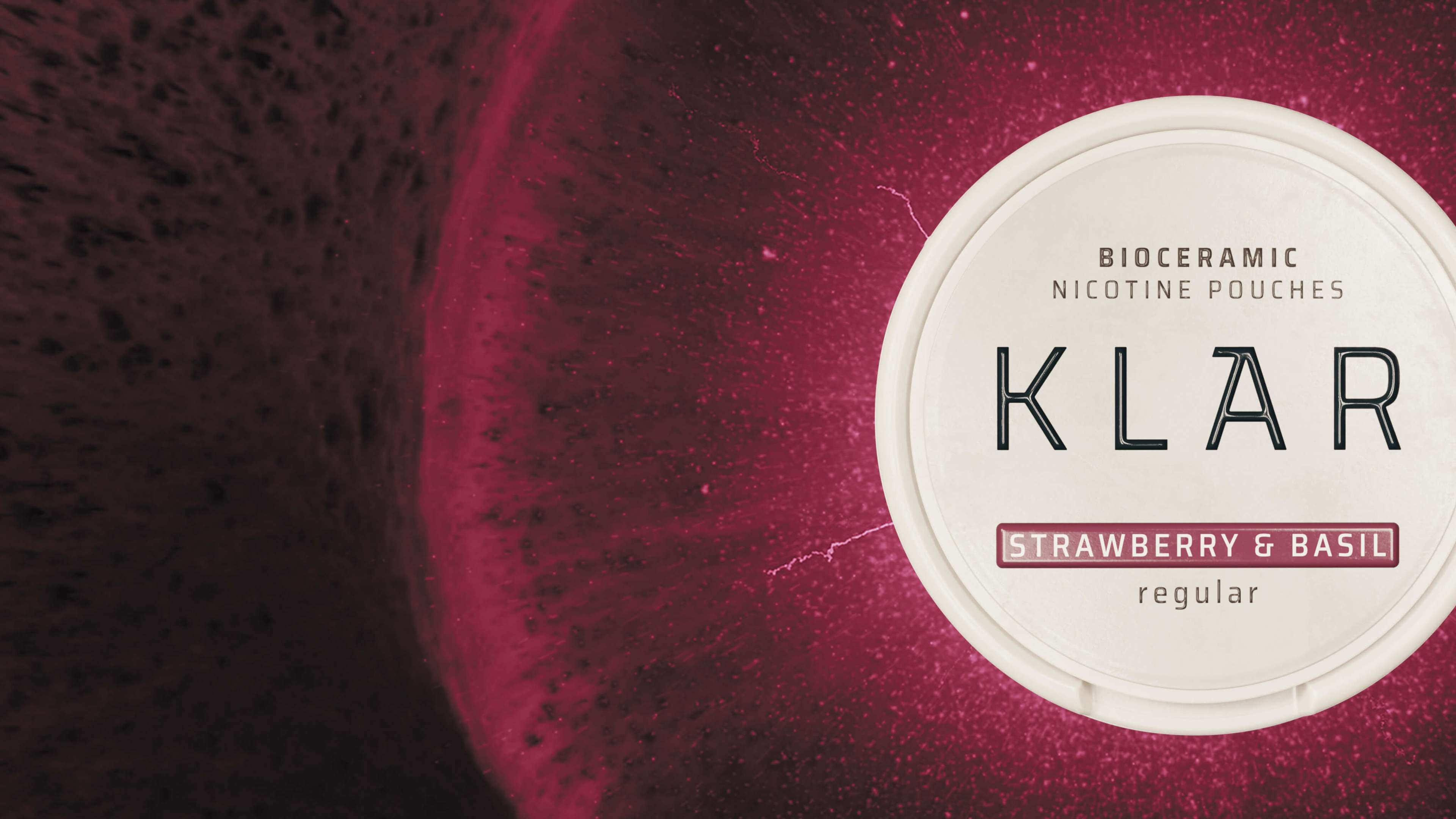 Bioceramic nicotine pouches "KLAR" in strawberry and basil flavor with a dark pink textured background.