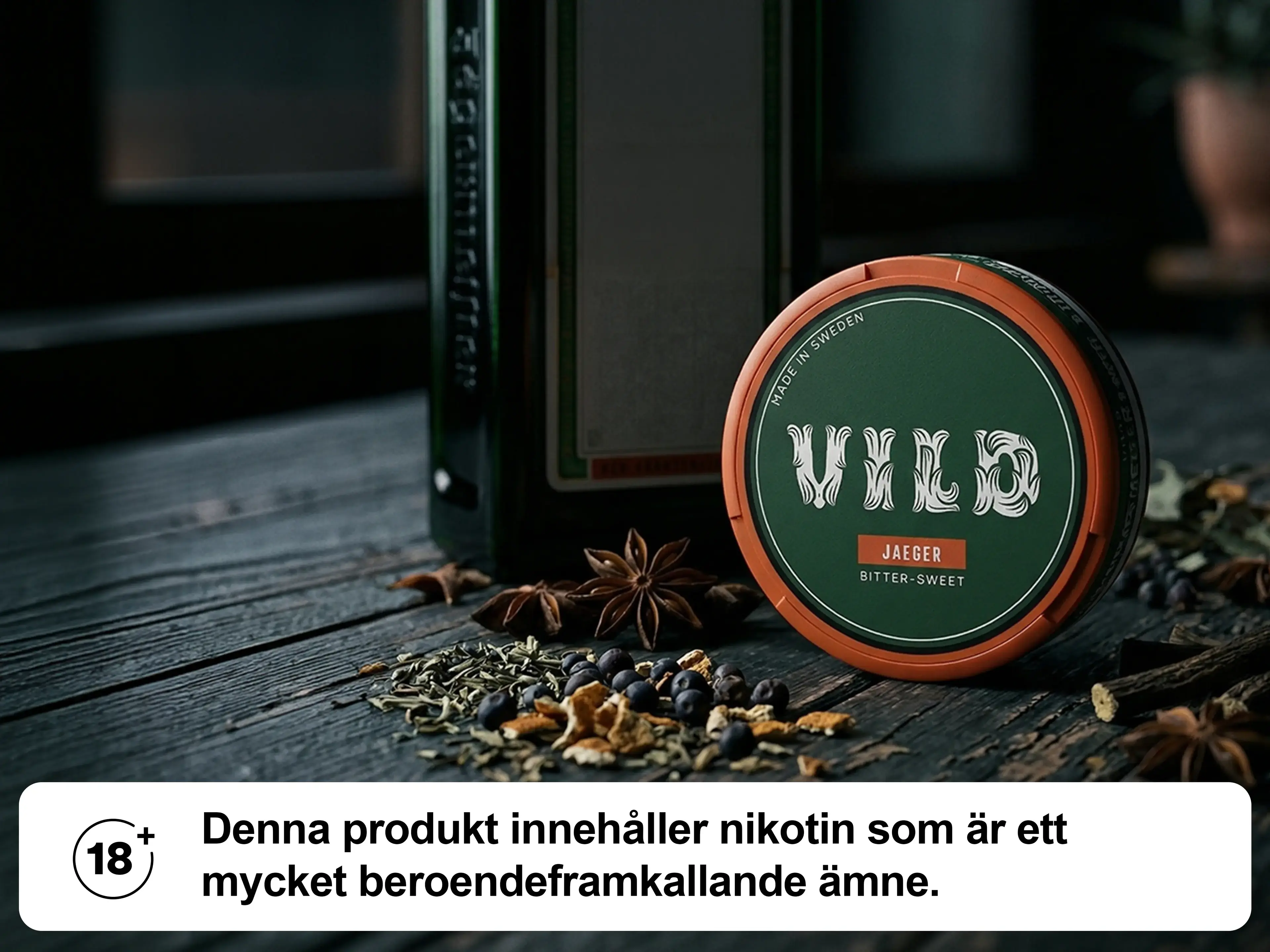 A can of "Vild Jaeger" with spices and a bottle on a wooden surface. Warning label: Contains nicotine, a highly addictive substance.