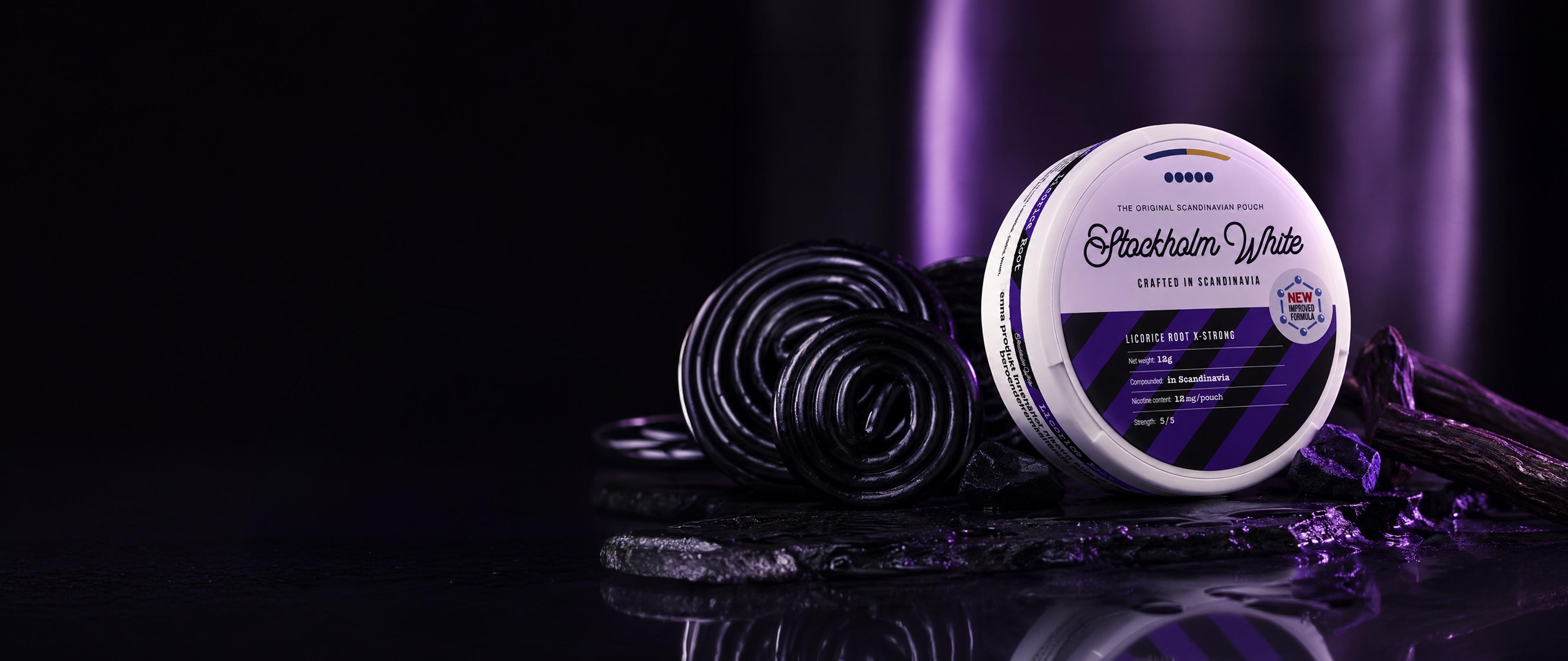 A can of Stockholm White licorice root nicotine pouches with coiled licorice on a dark surface, illuminated by purple lighting.