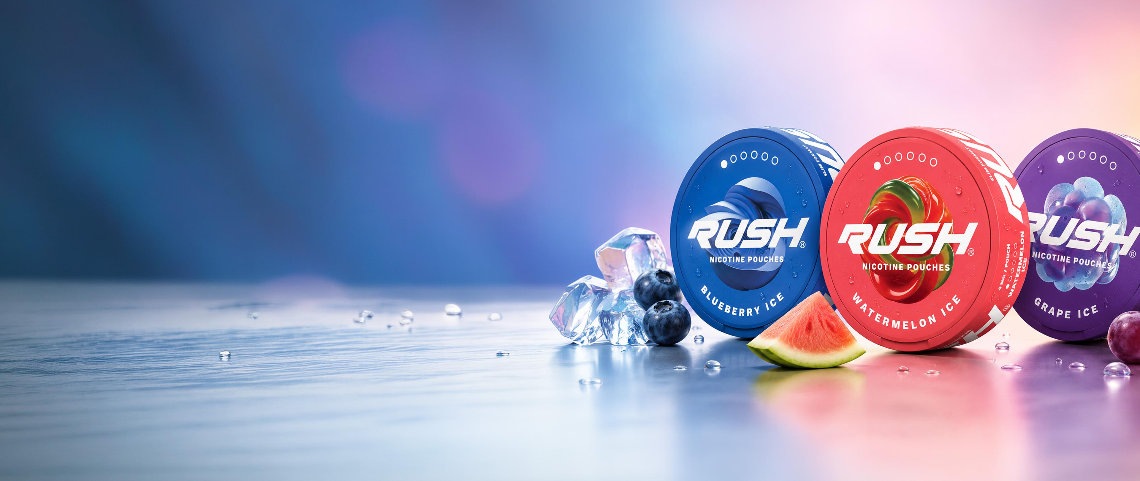 Three RUSH nicotine pouches in blue, red, and purple containers labeled Blueberry Ice, Watermelon Ice, Grape Ice, with ice, blueberries, watermelon, and grapes.