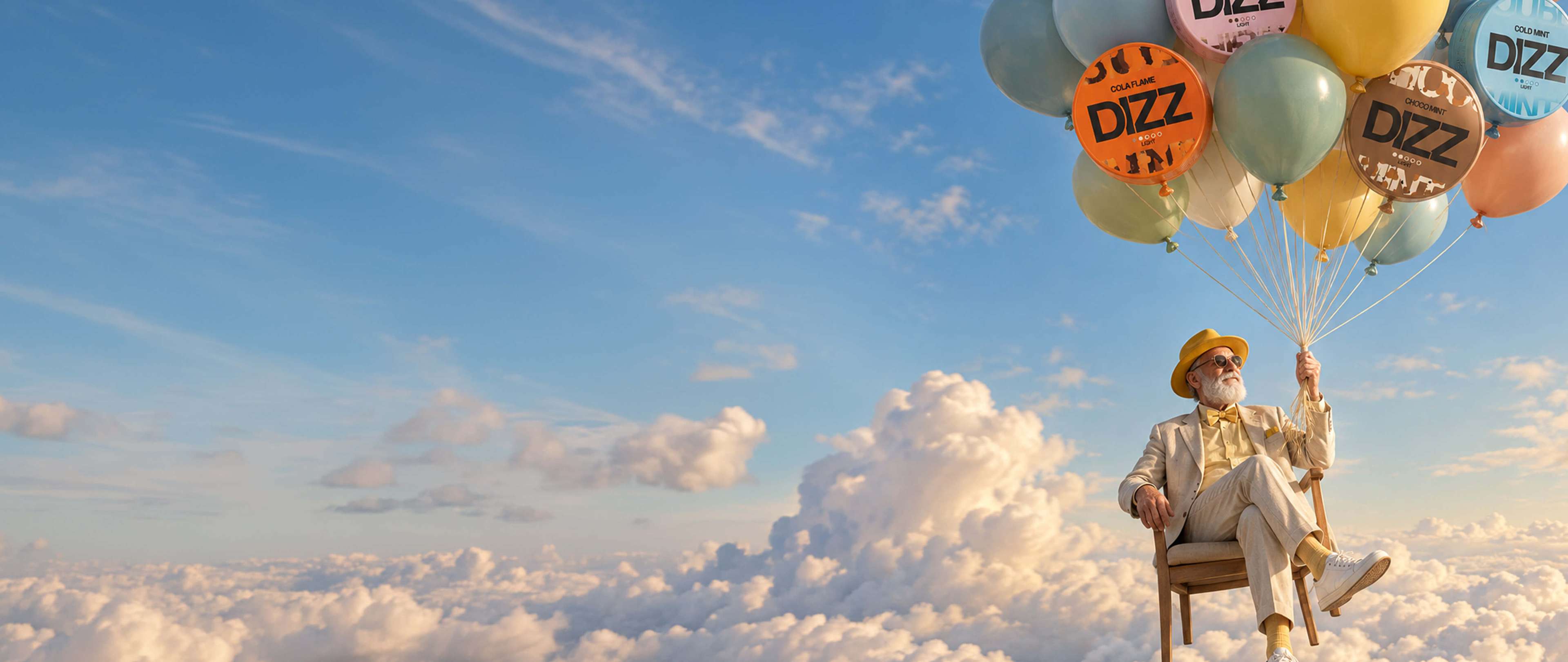 A man in a yellow hat and suit sits on a chair floating above the clouds, holding colorful balloons against a blue sky.