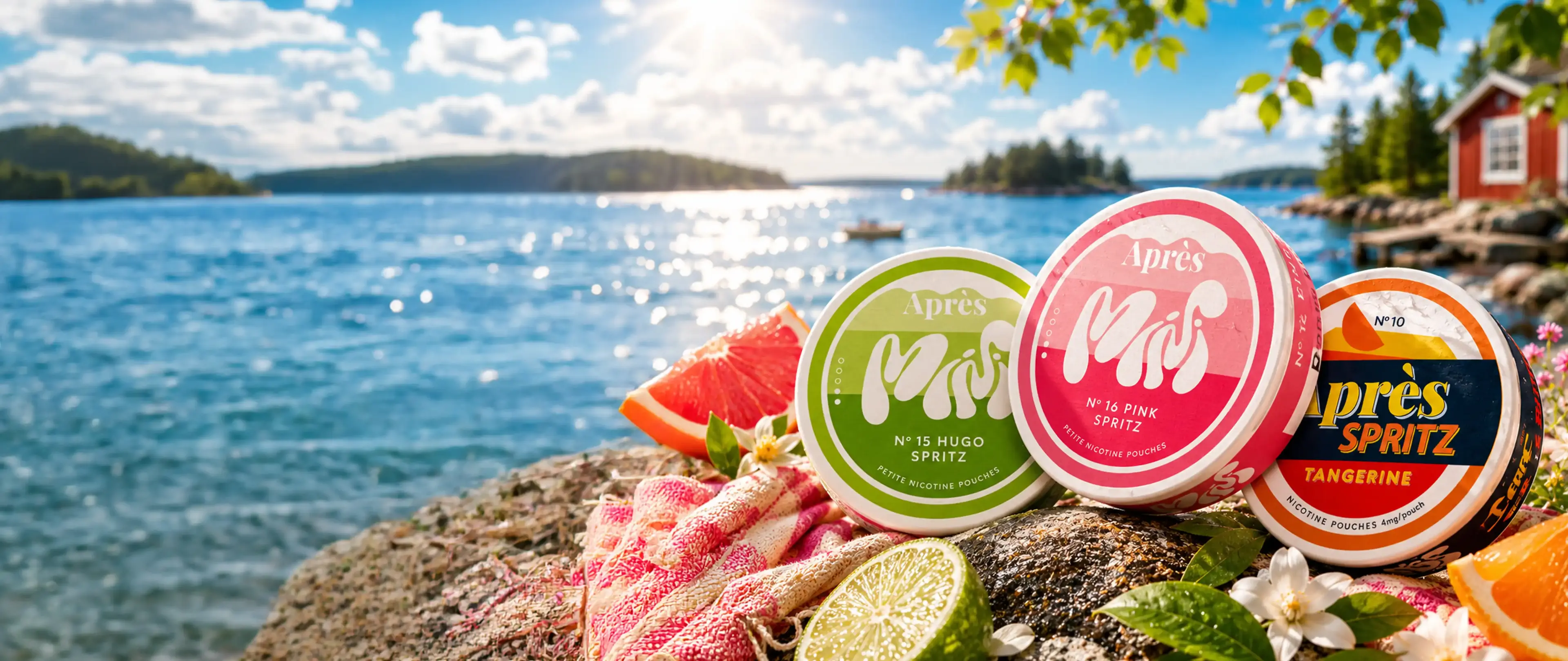 Assorted Après nicotine pouches on a rock by a sunny lake, surrounded by sliced citrus fruits and flowers.