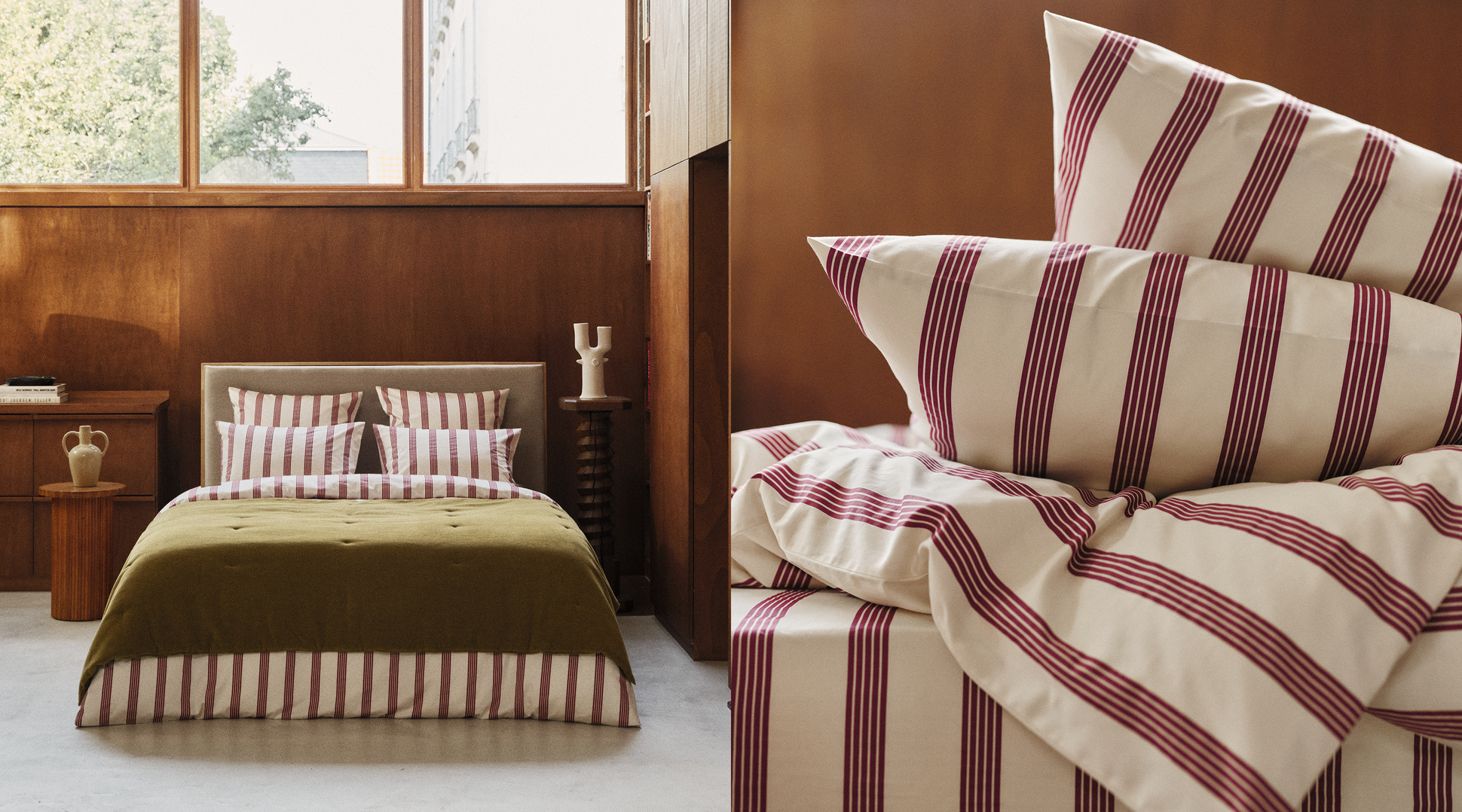 Linge de lit rayé de bordeaux et de blanc sur un lit agrémenté de plusieurs oreillers et d'une couette, dans une chambre à l'ambiance chaleureuse.