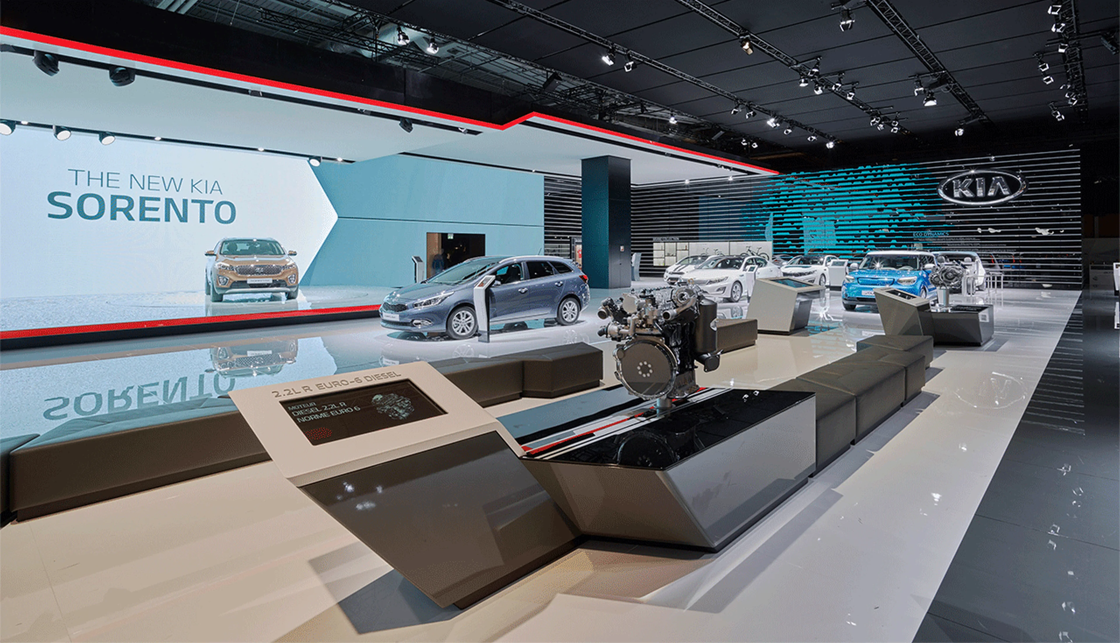 Kia exhibition booth at the Geneva Motor Show 2015 featuring modern car displays and innovative designs.
