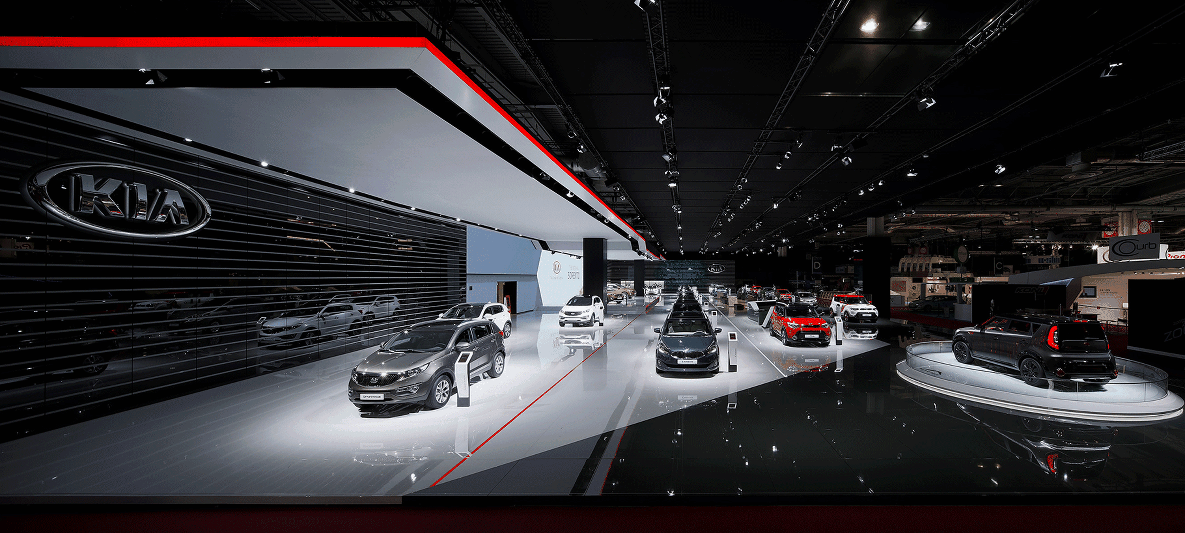 Kia exhibition booth at the Geneva Motor Show 2015 featuring modern car displays and innovative designs.