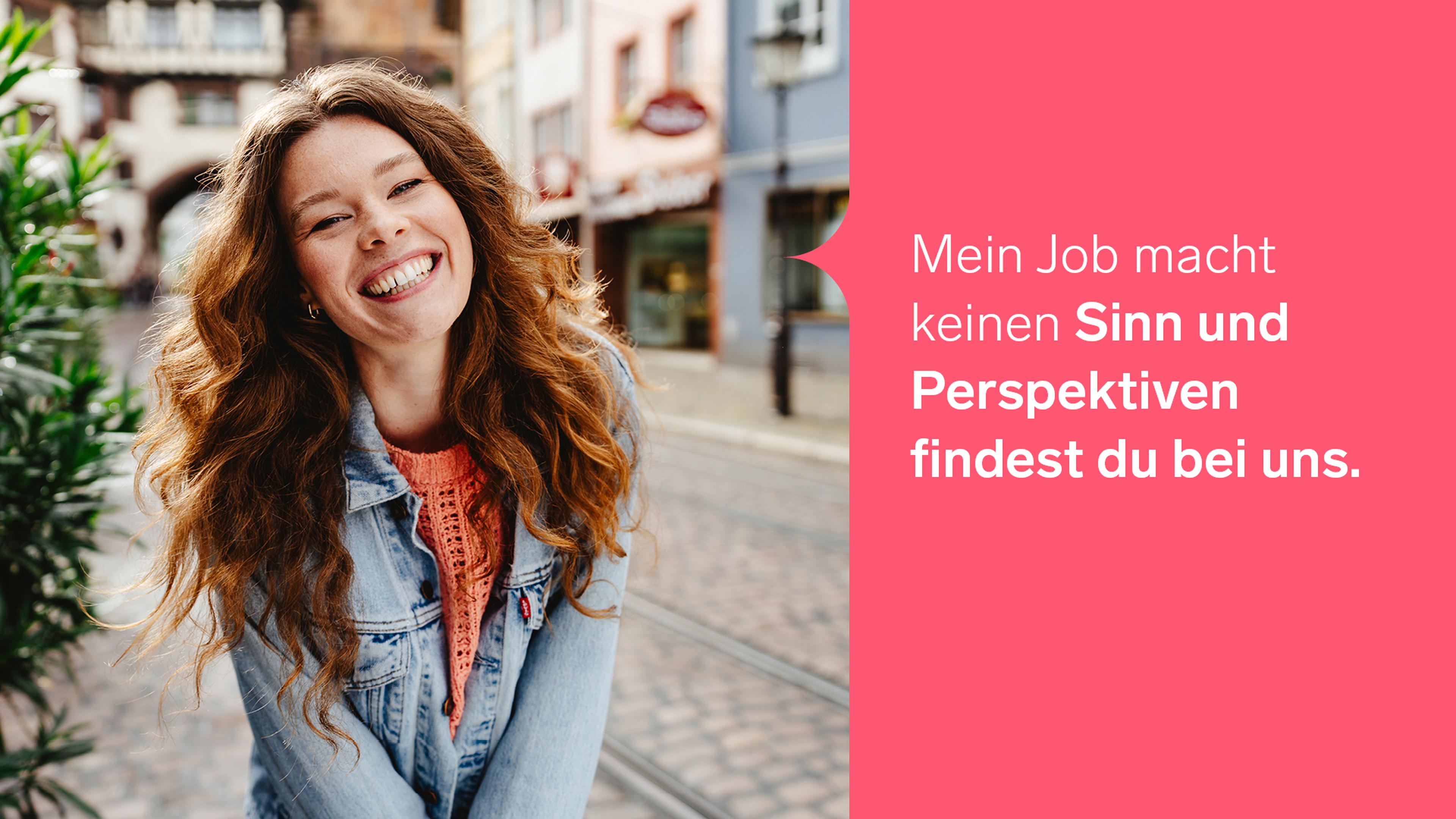 Smiling woman with long hair in a denim jacket stands outdoors. German text on right: “My job makes no sense, but you'll find prospects with us.”