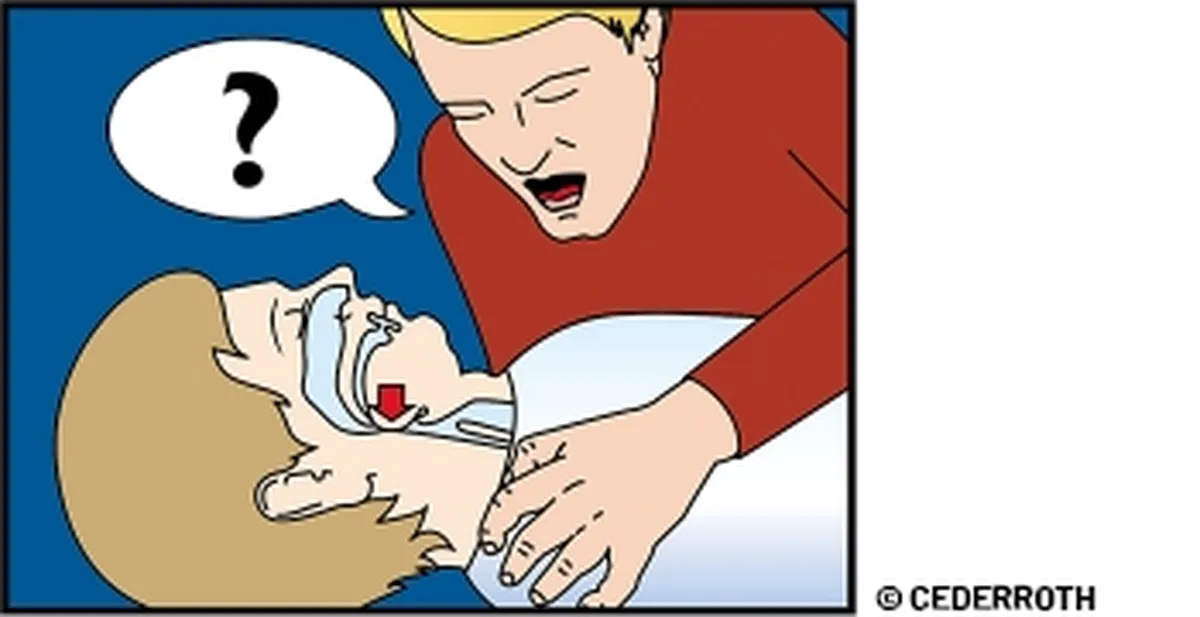 En person som kontrollerar om en annan person är vid medvetande