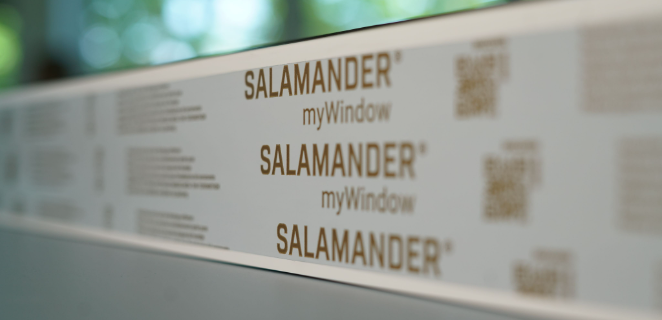 A close-up of a white label with the word "Salamander" repeated three times in gold font, along with the phrase "myWindow" in smaller font below each instance.