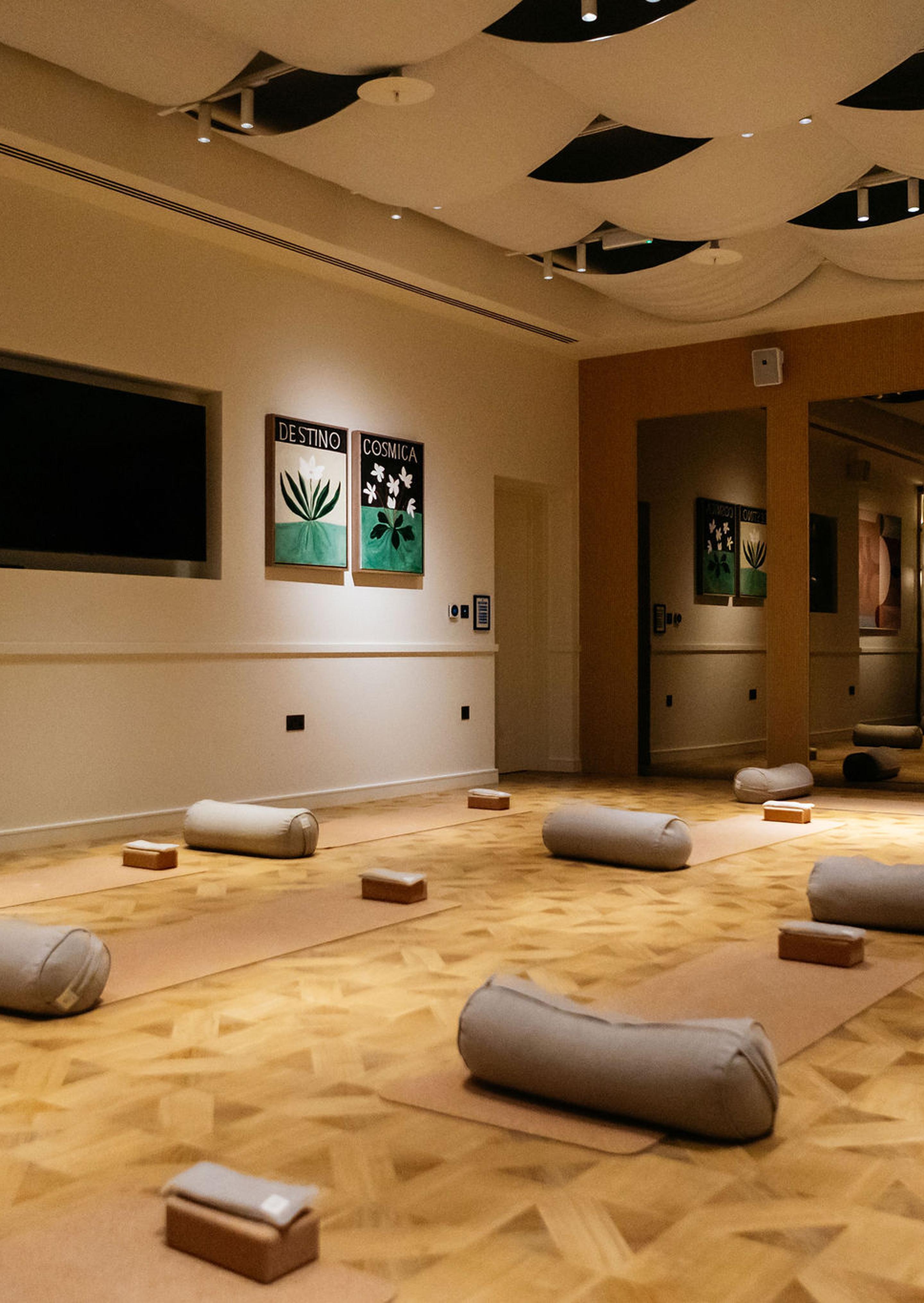 Yoga studio with mats and bolsters at The Eades luxury apartments to rent, secure living amenities. [G]