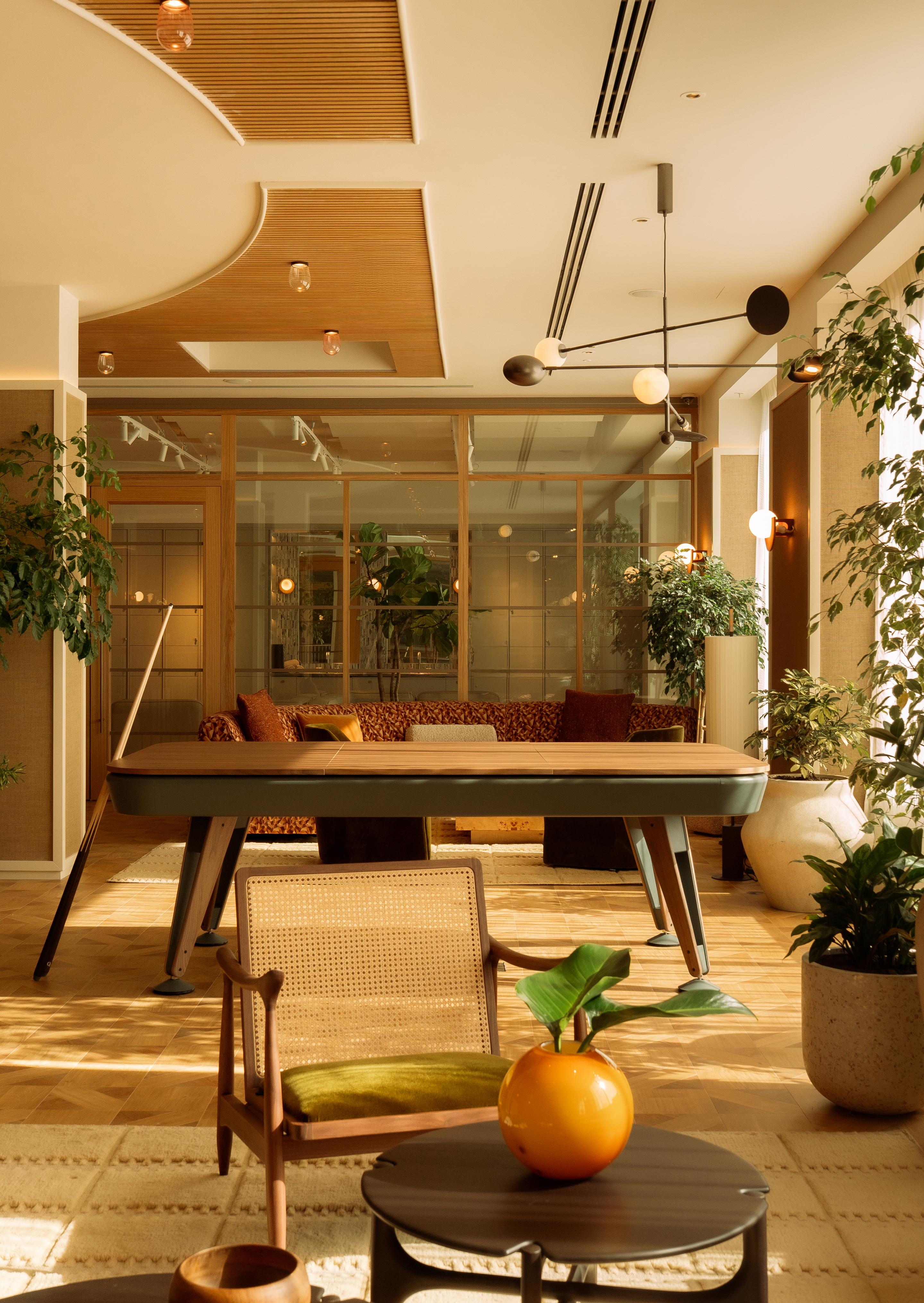 Image of stylish lounge with co-working spaces at The Eades luxury apartments to rent. [G]