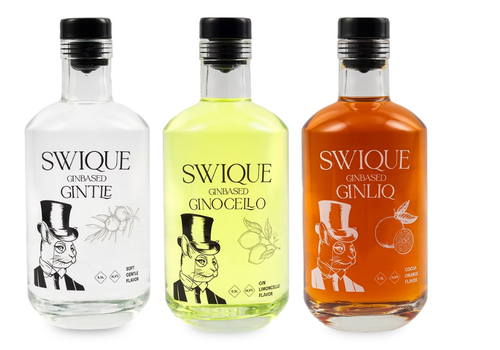 Three Swique gin-based liqueur bottles in a row: clear, yellow, and orange, each with a dapper rabbit illustration on the label.