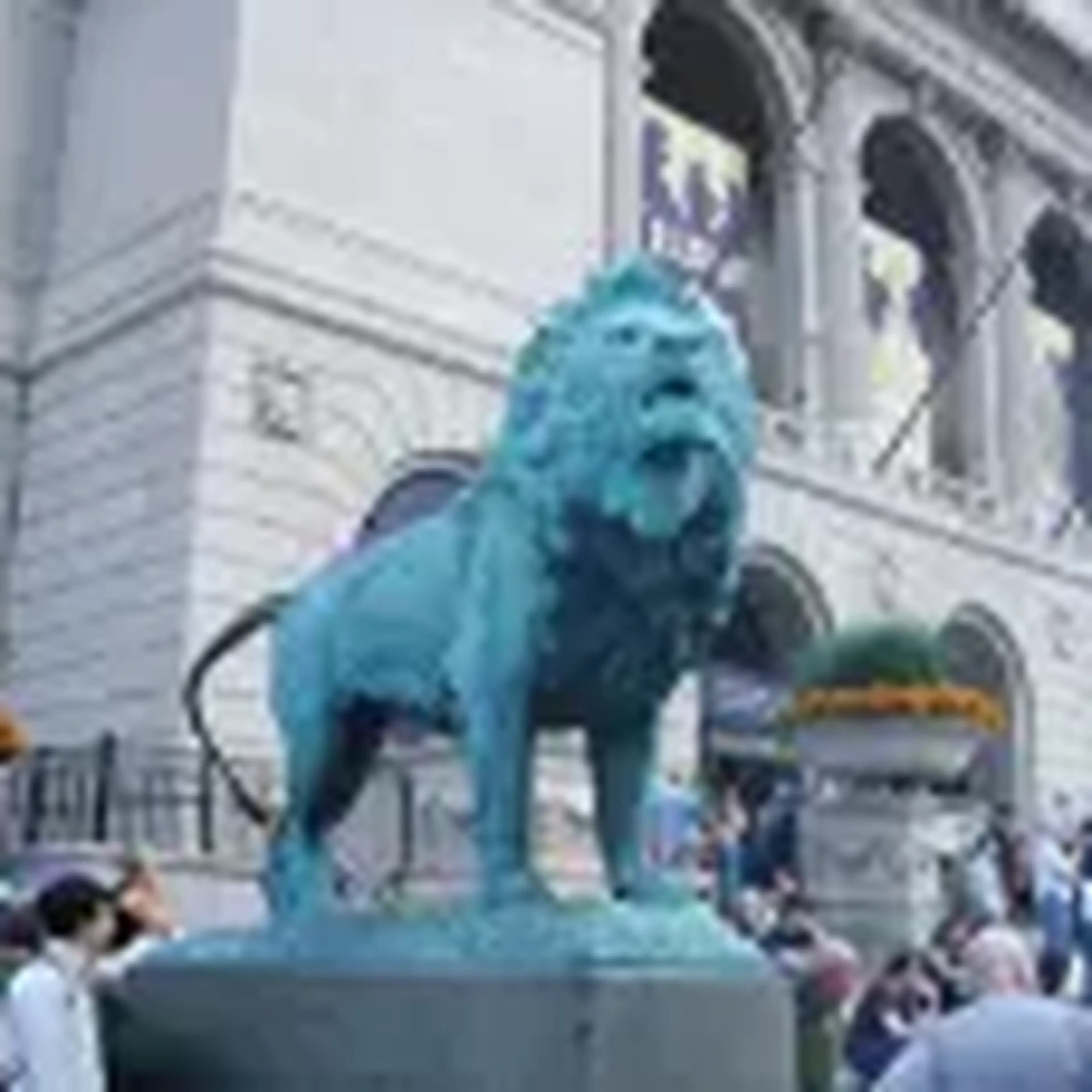 lion statue outside of the metropolitan museum of art