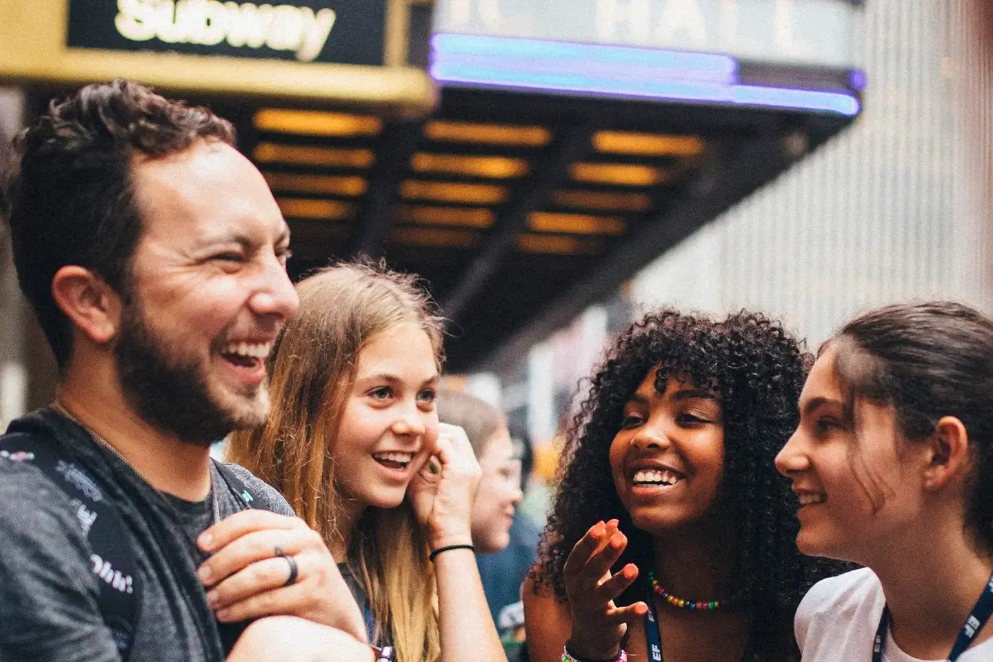 Adult chaperone talking to students on tour