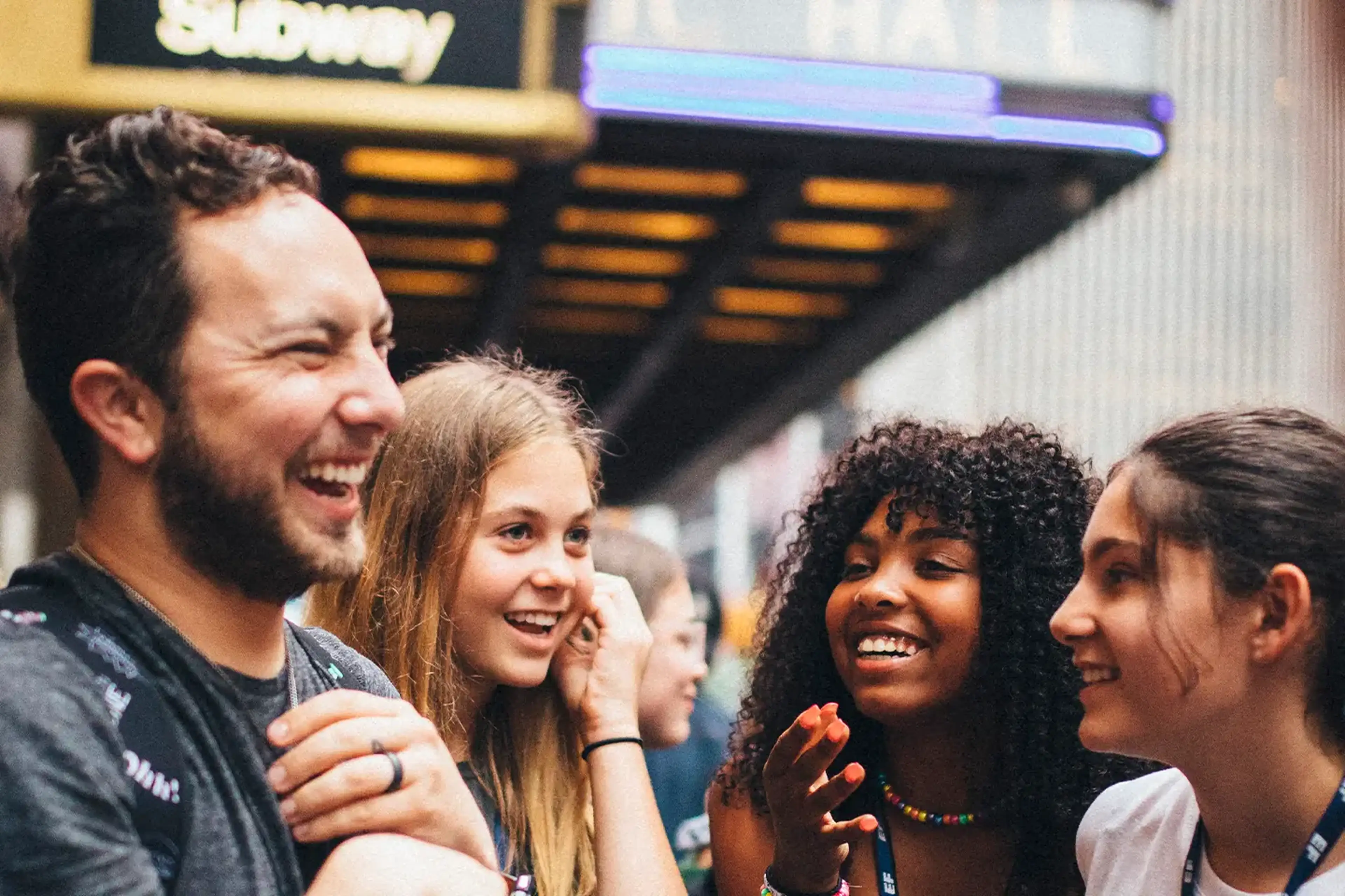 Adult chaperone talking to students on tour