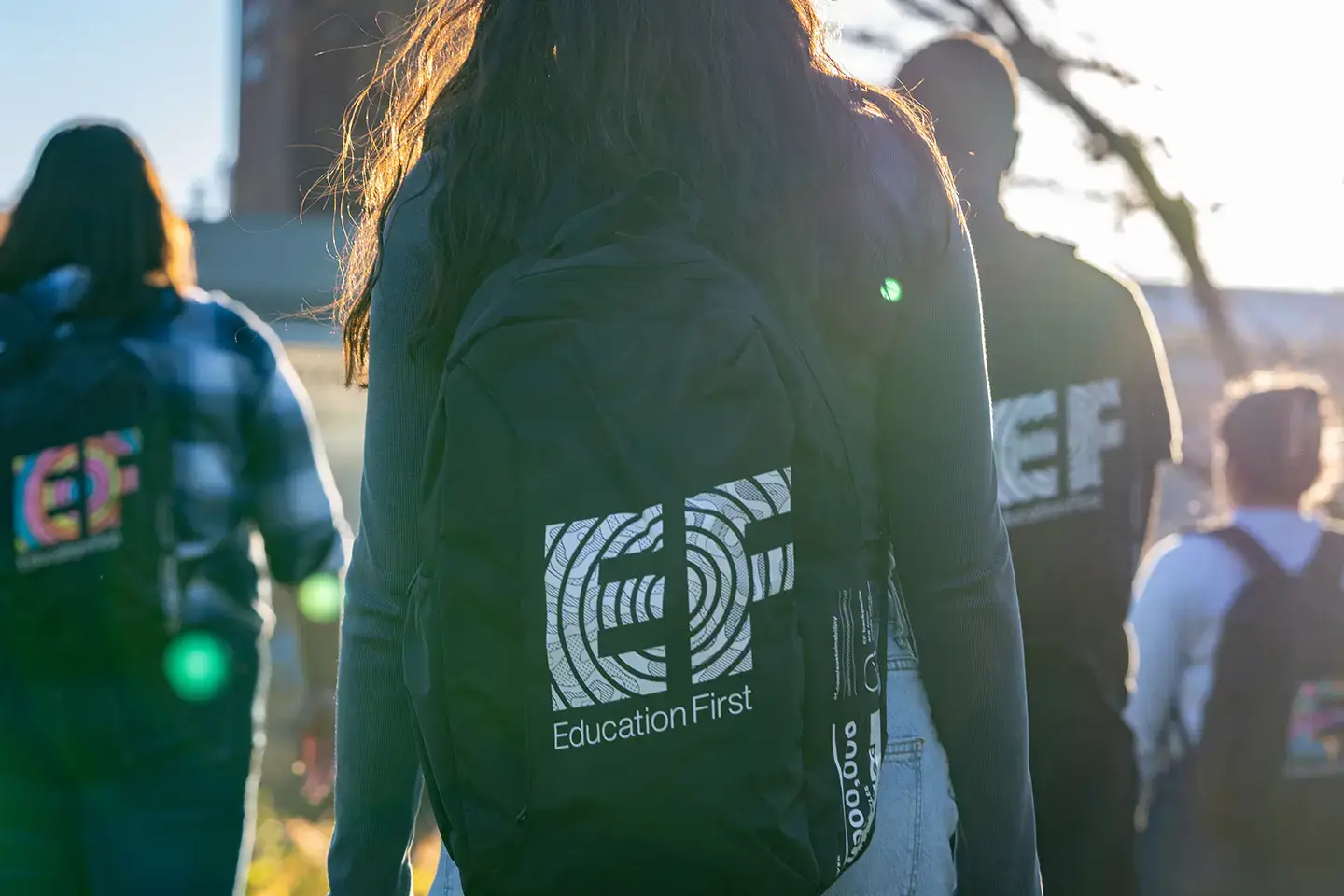 Students carrying EF backpacks