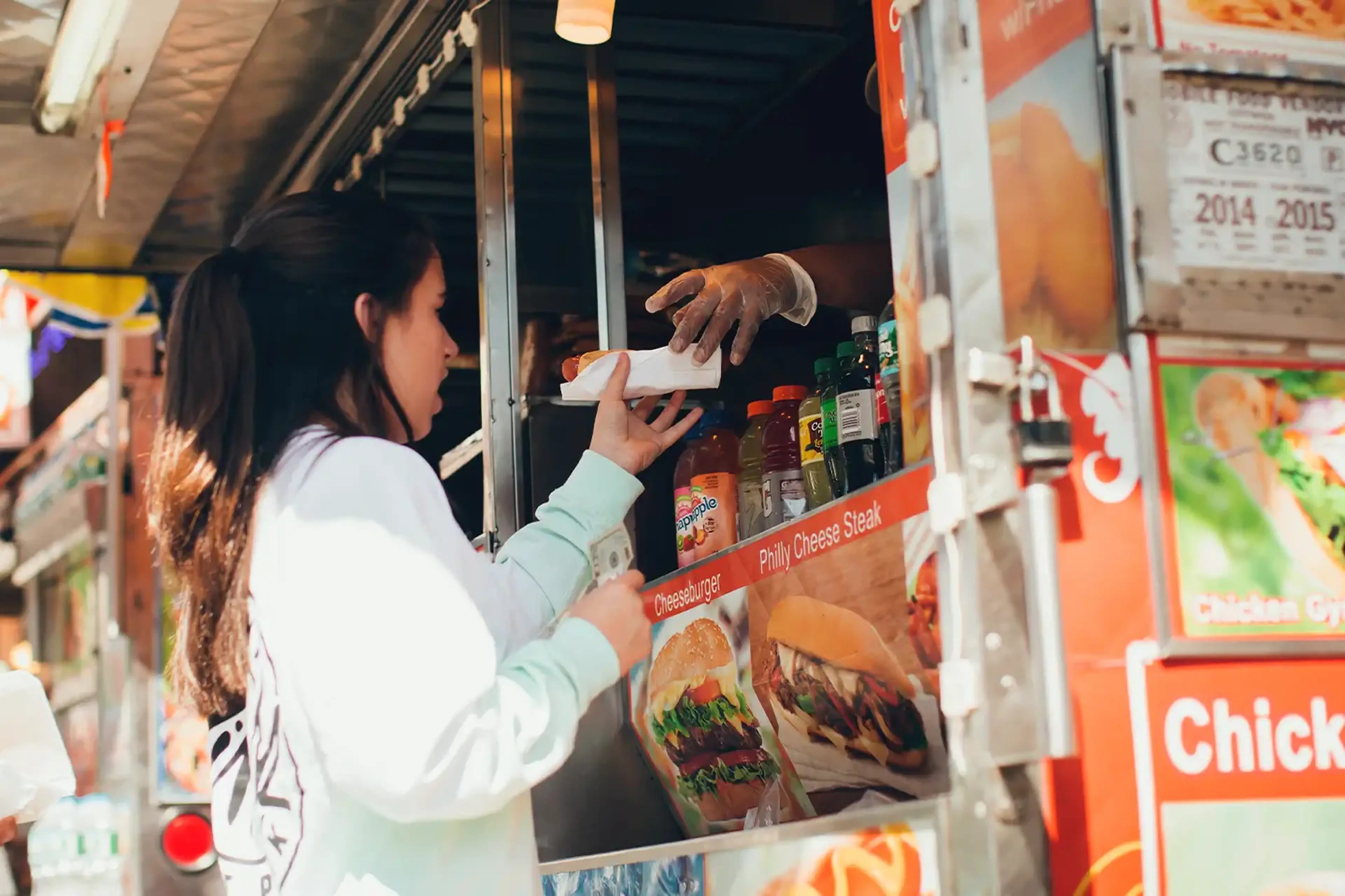 Student getting food from street truck