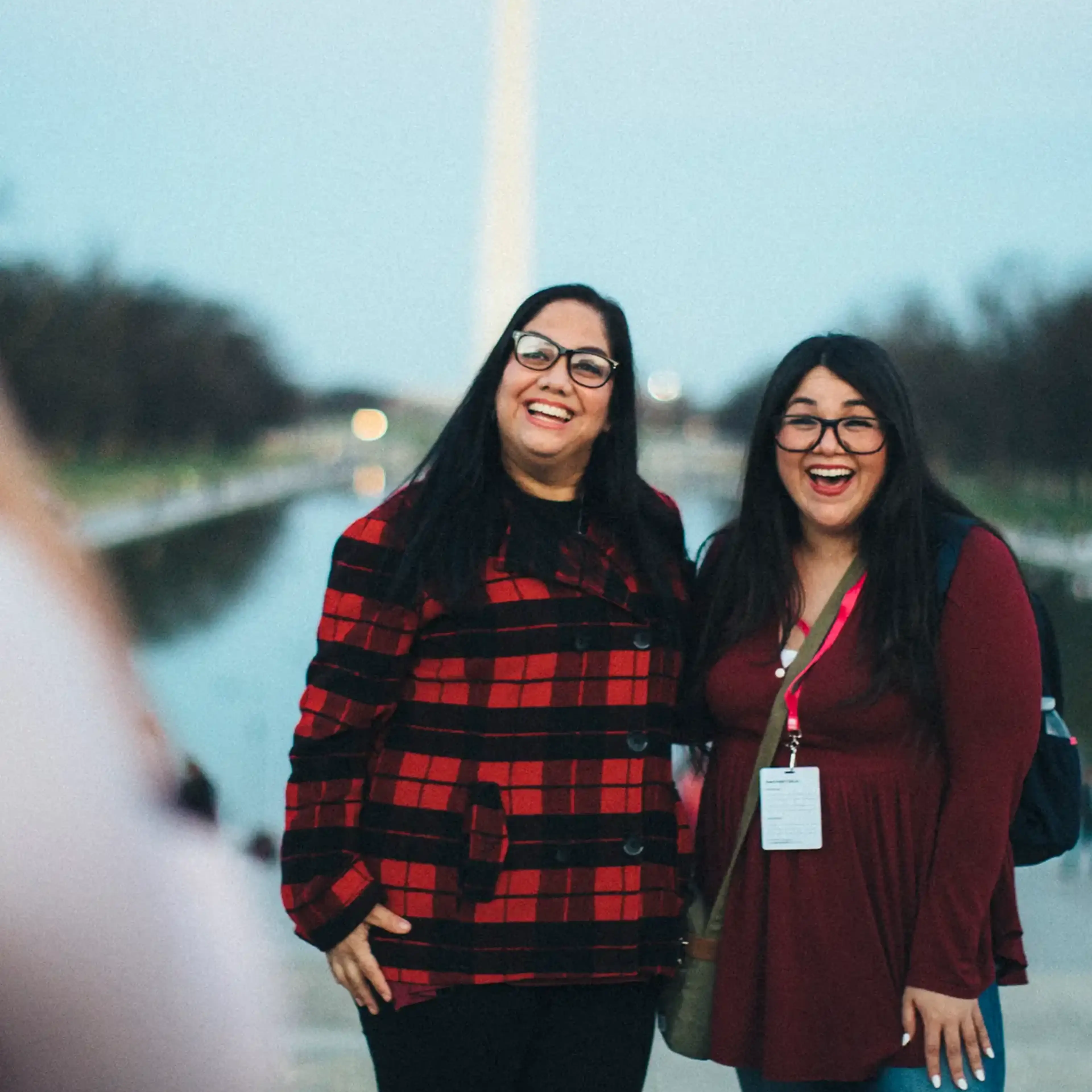 Two teachers taking a photo in front of the Washington Monument