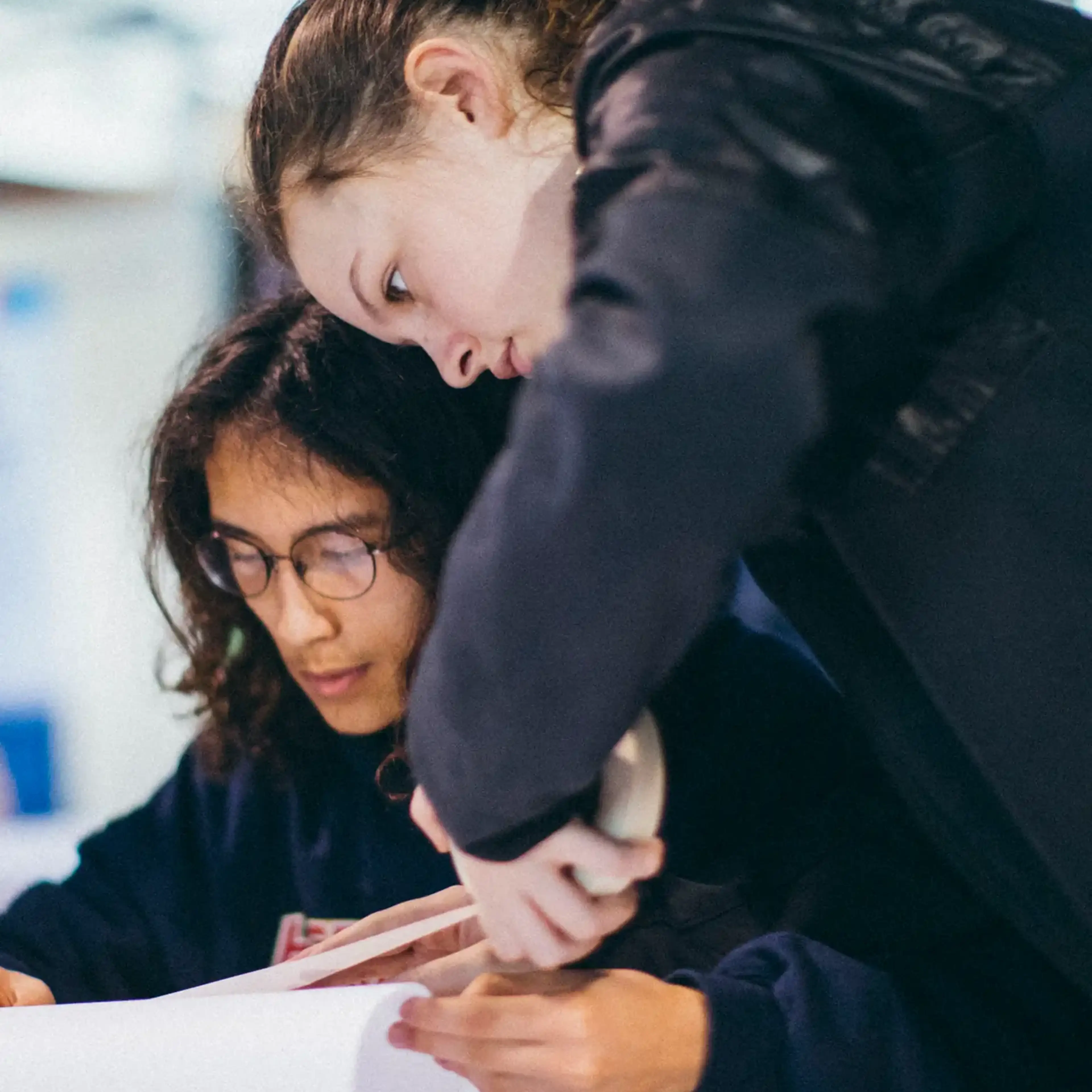 Two students studying on tour