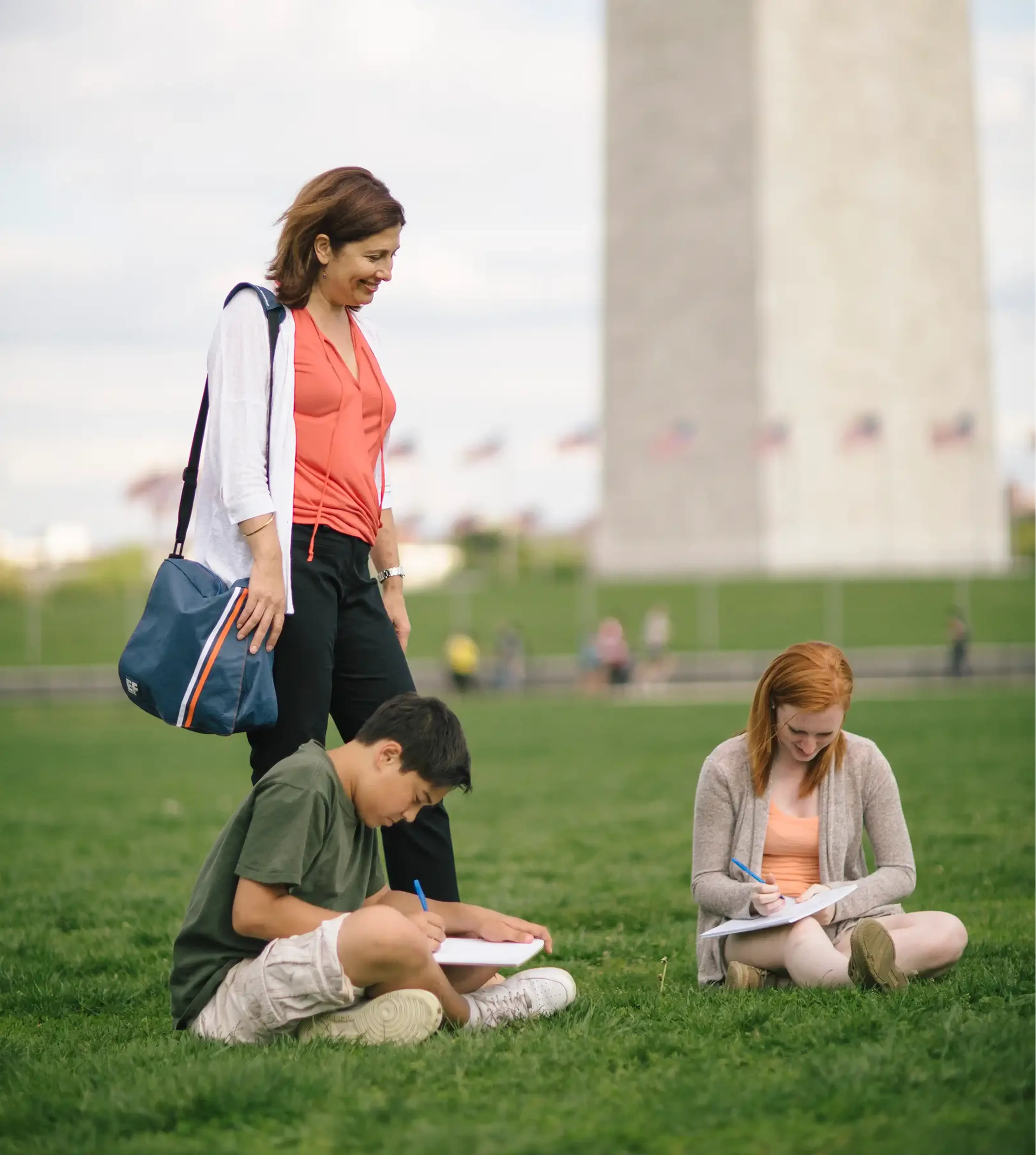 two students and a teacher at the washington monument