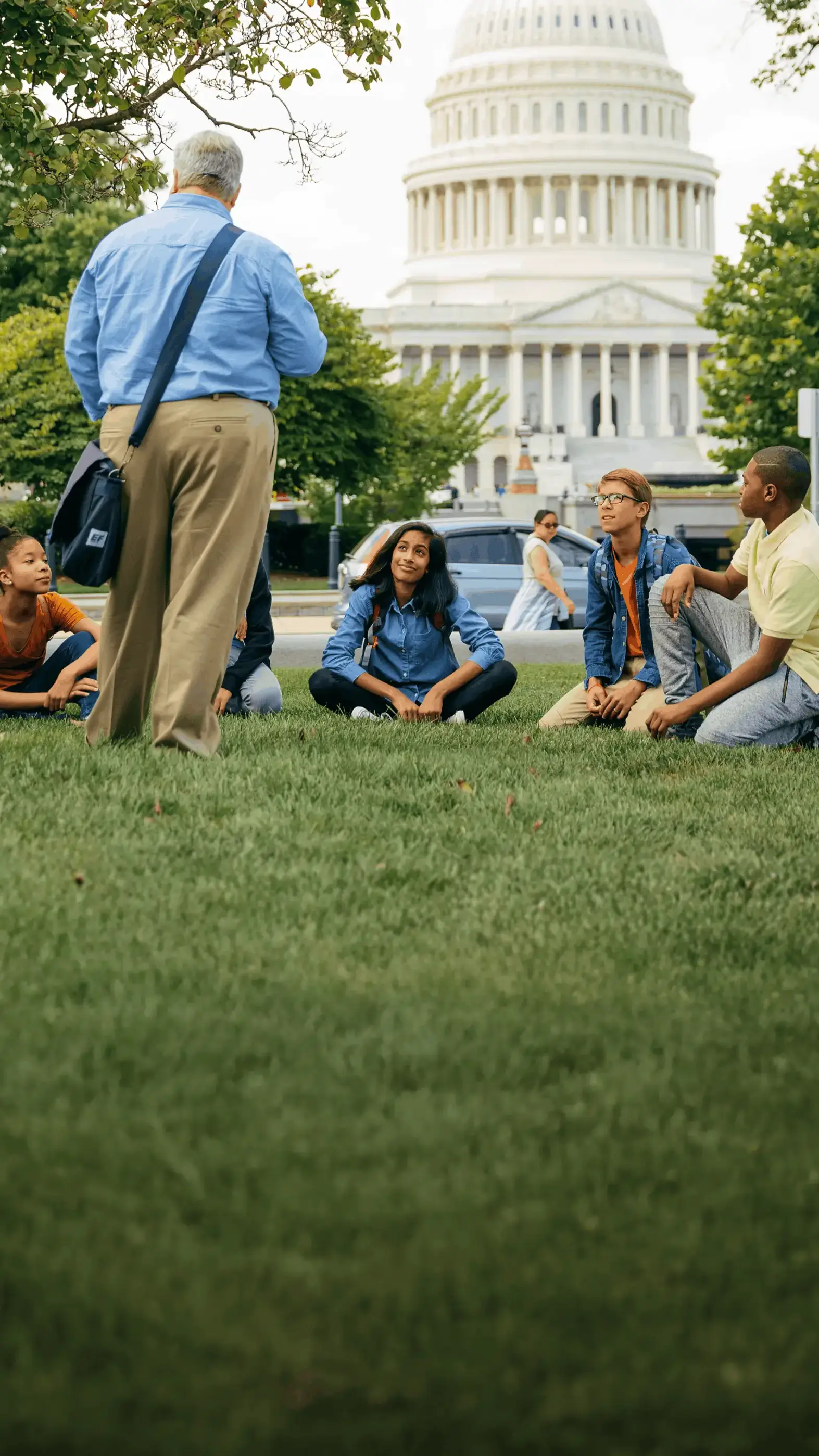 Tour Director speaking to a group of travelers outside of the U.S. Capitol building