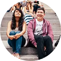 high school students sitting on stone steps