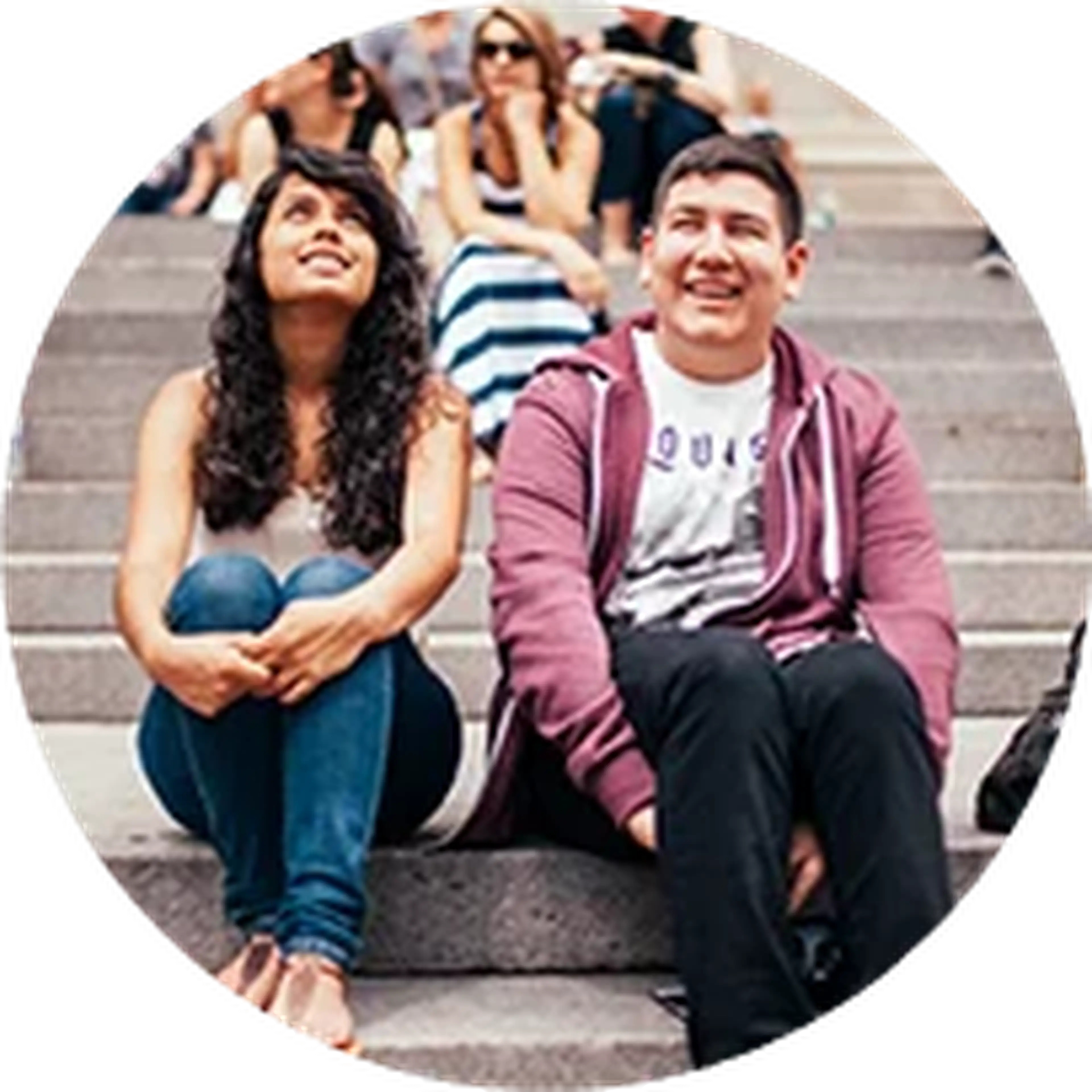 high school students sitting on stone steps