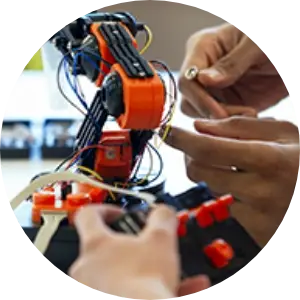 hands working on a robot