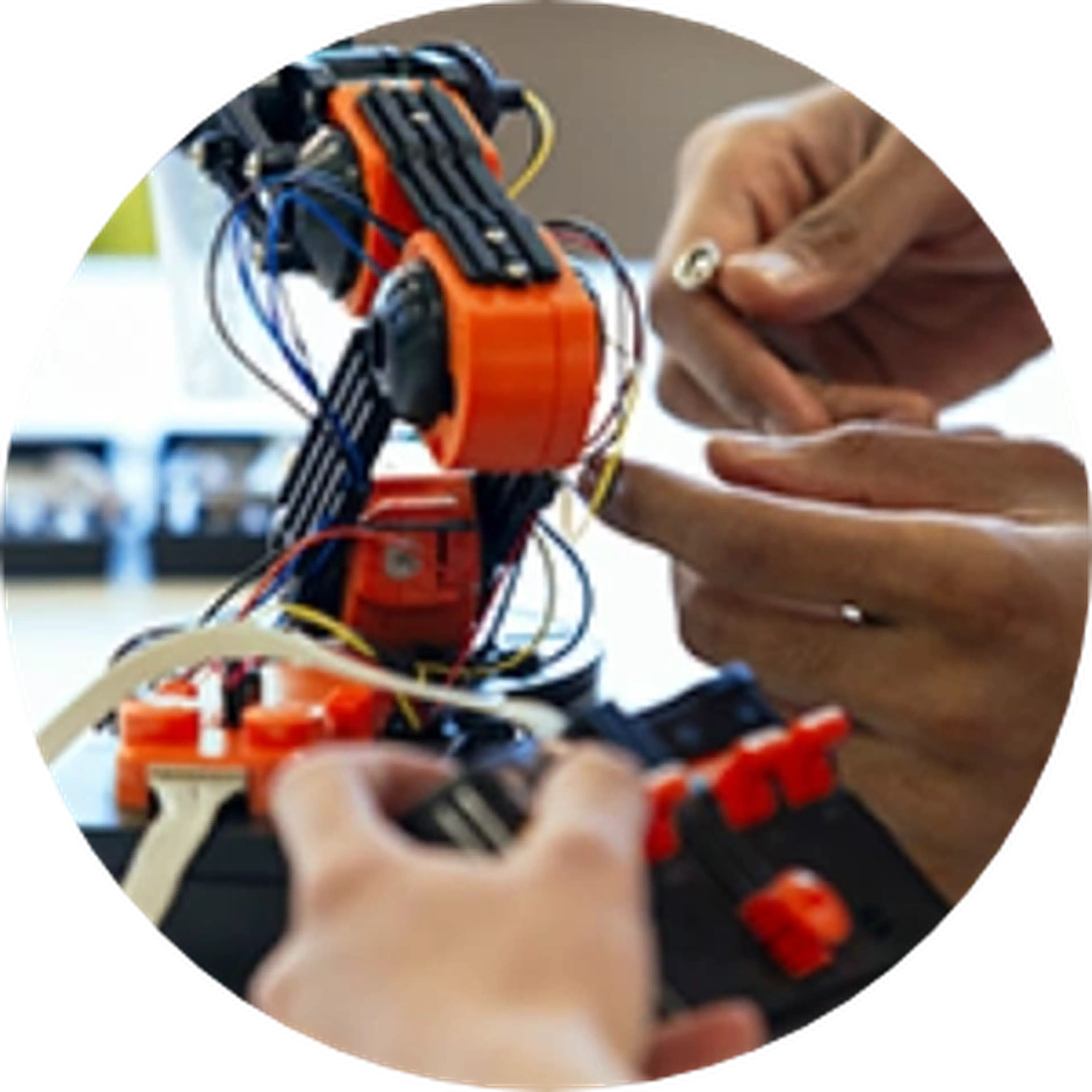 hands working on a robot