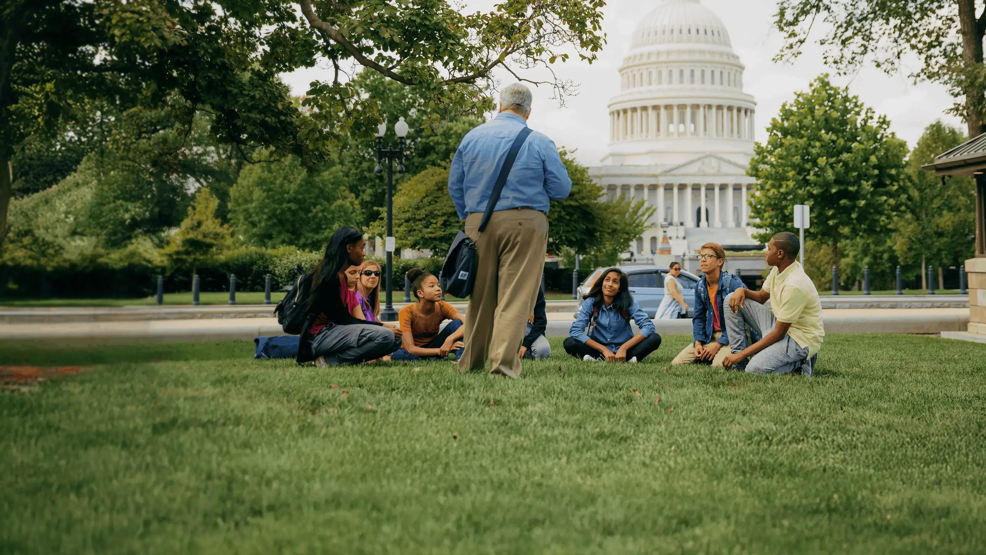 Tour Director speaking to a group of travelers outside of the U.S. Capitol building