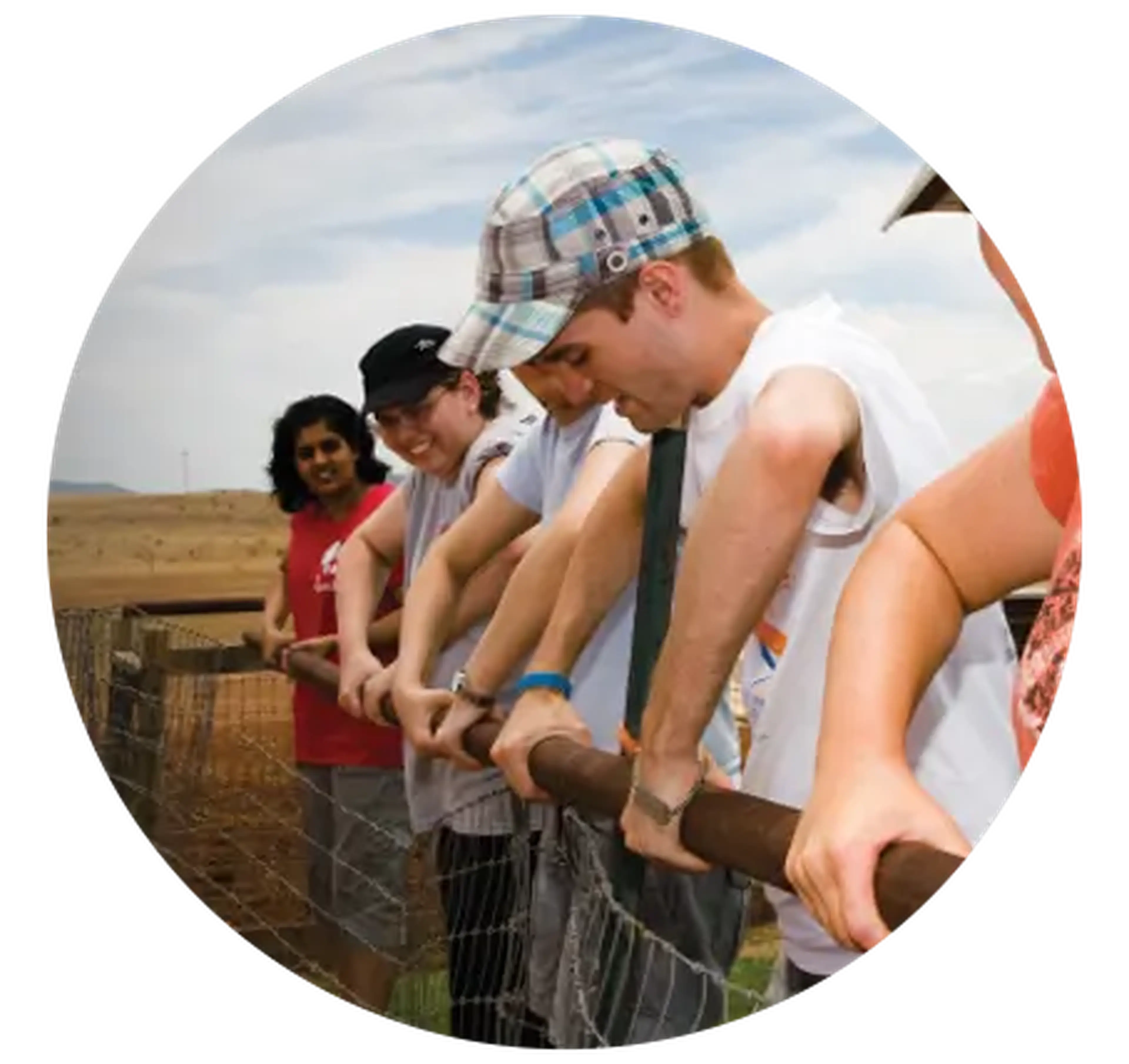 student group working on a fence