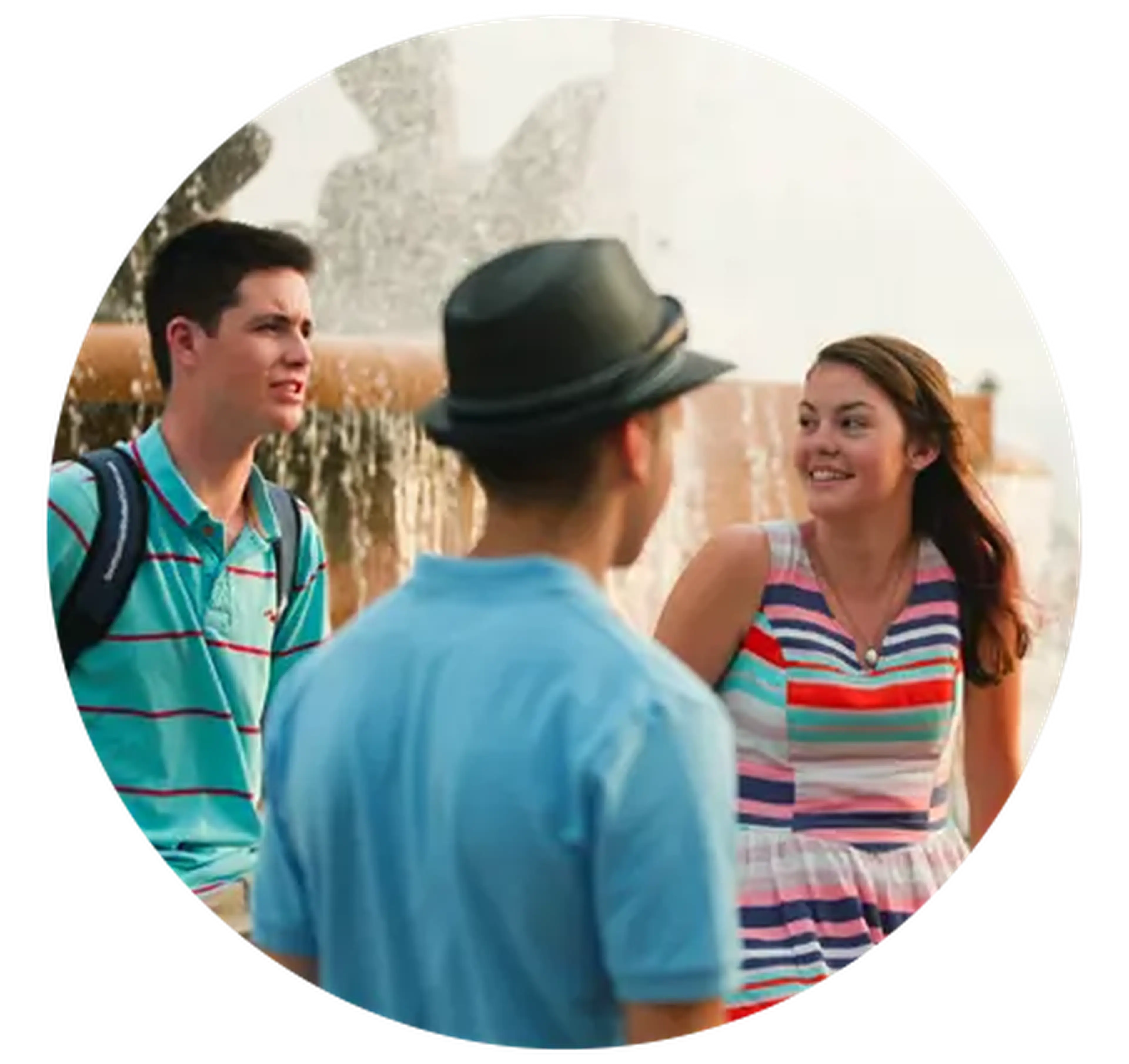 students chatting near a fountain