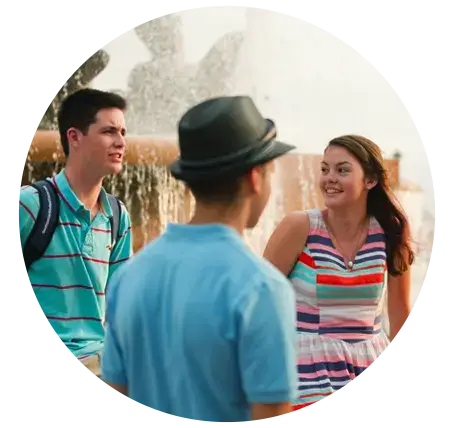 students chatting near a fountain