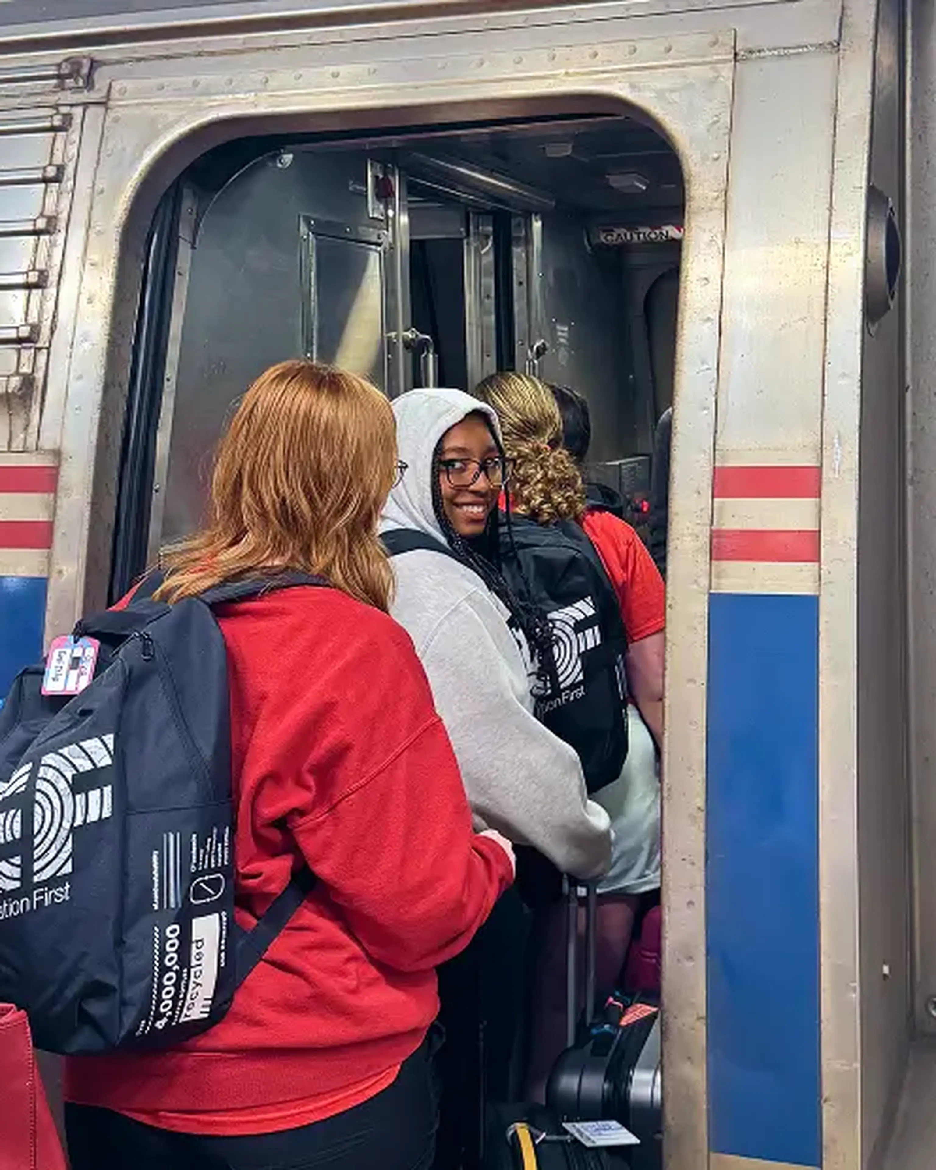 students boarding an amtrak train