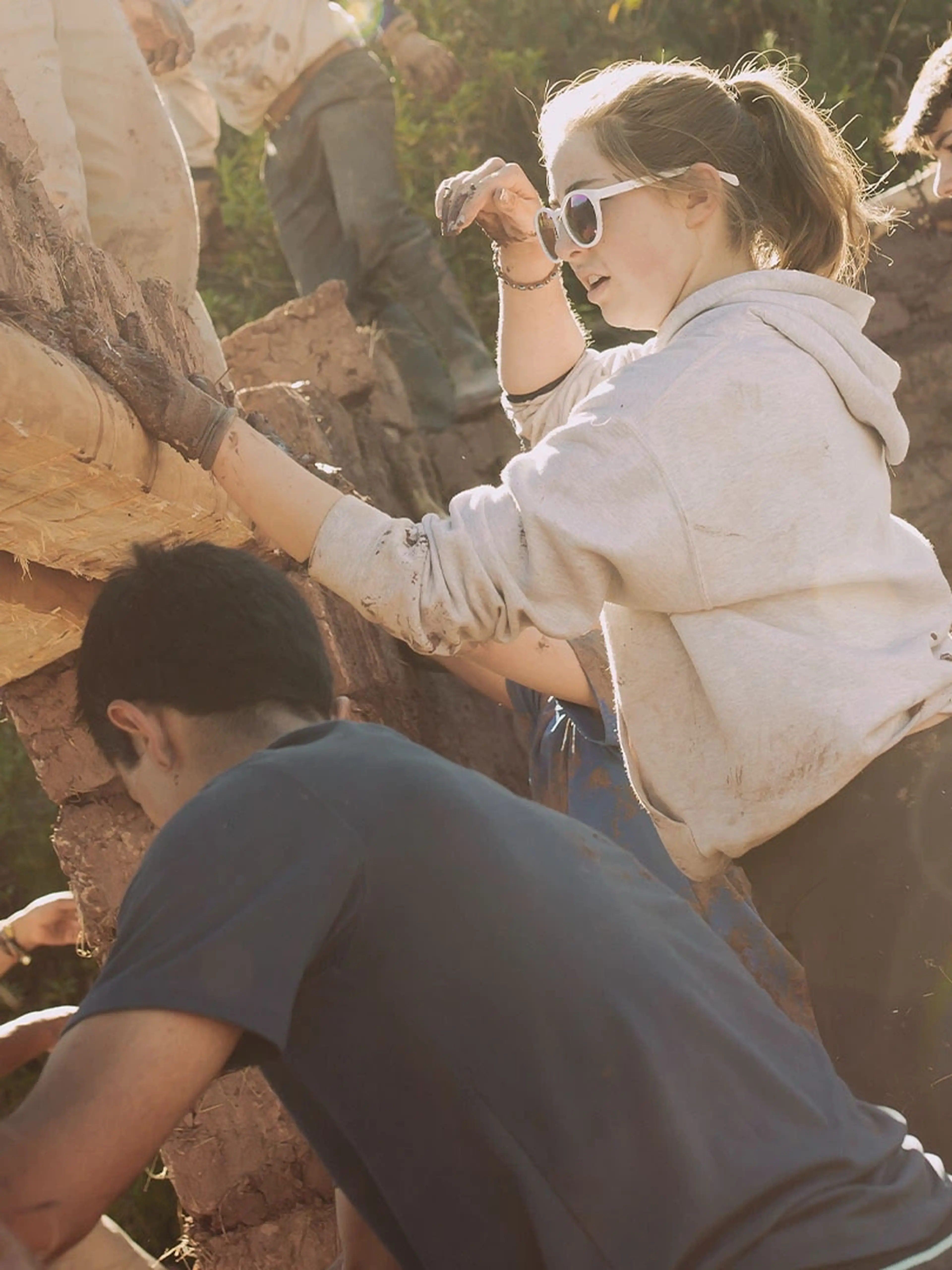students working together on a service learning class trip