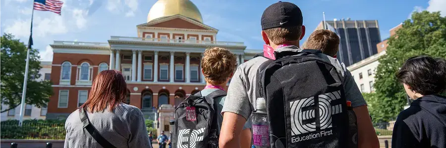 Student wearing EF backpack looking at the Massachusetts State House